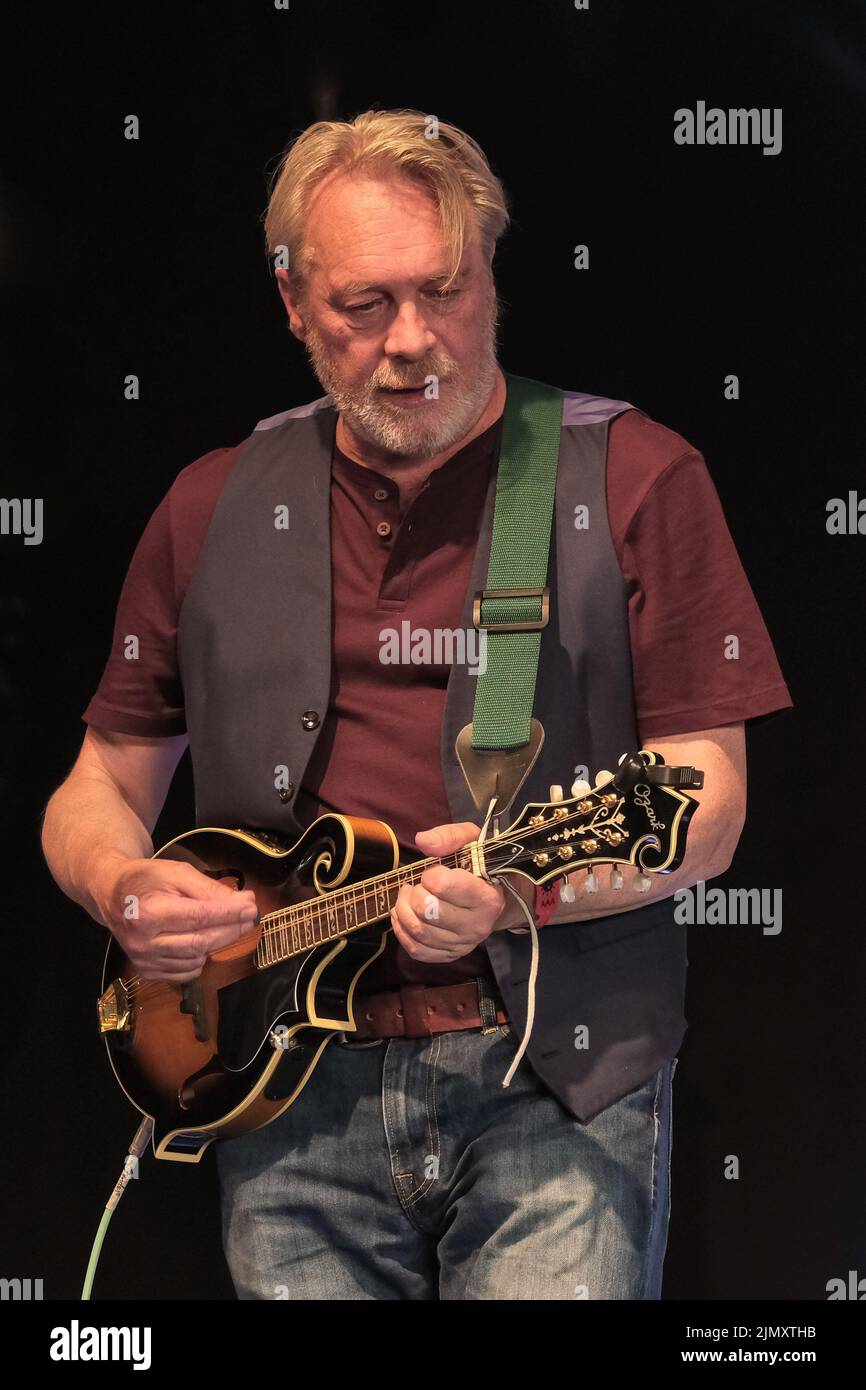 Wickham, UK. 07th Aug, 2022. Guitarist Paul Simmonds British folk punk band The Men They Couldn't Hang (TMTCH) performing live on stage at Wickham Festival. The Men They Couldn't Hang (TMTCH) are a British folk punk group. The original group consisted of Stefan Cush (vocals, guitar), Paul Simmonds (guitar, bouzouki, mandolin, keyboards), Philip 'Swill' Odgers (vocals, guitar, tin whistle, melodica), Jon Odgers (drums, percussion), and Shanne Bradley (bass guitar) Credit: SOPA Images Limited/Alamy Live News Stock Photo