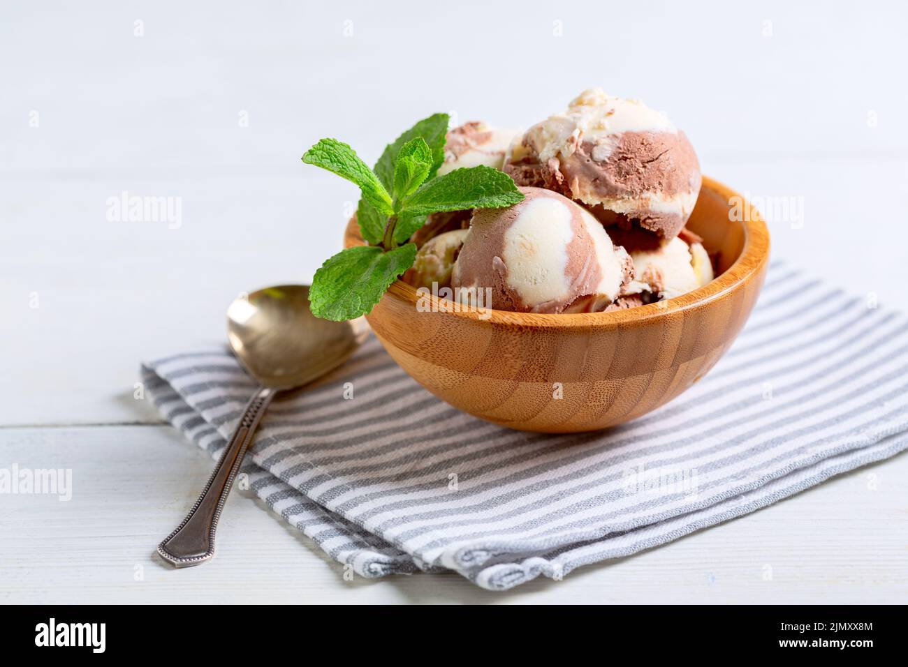 Chocolate-vanilla ice cream in a wooden bowl Stock Photo - Alamy