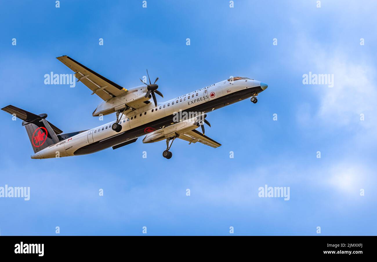 Airplane from Canada in sky. Air Canada approaching Vancouver Airport-August 2,2022. Air Canada is the flag carrier and largest airline of Canada. Tra Stock Photo