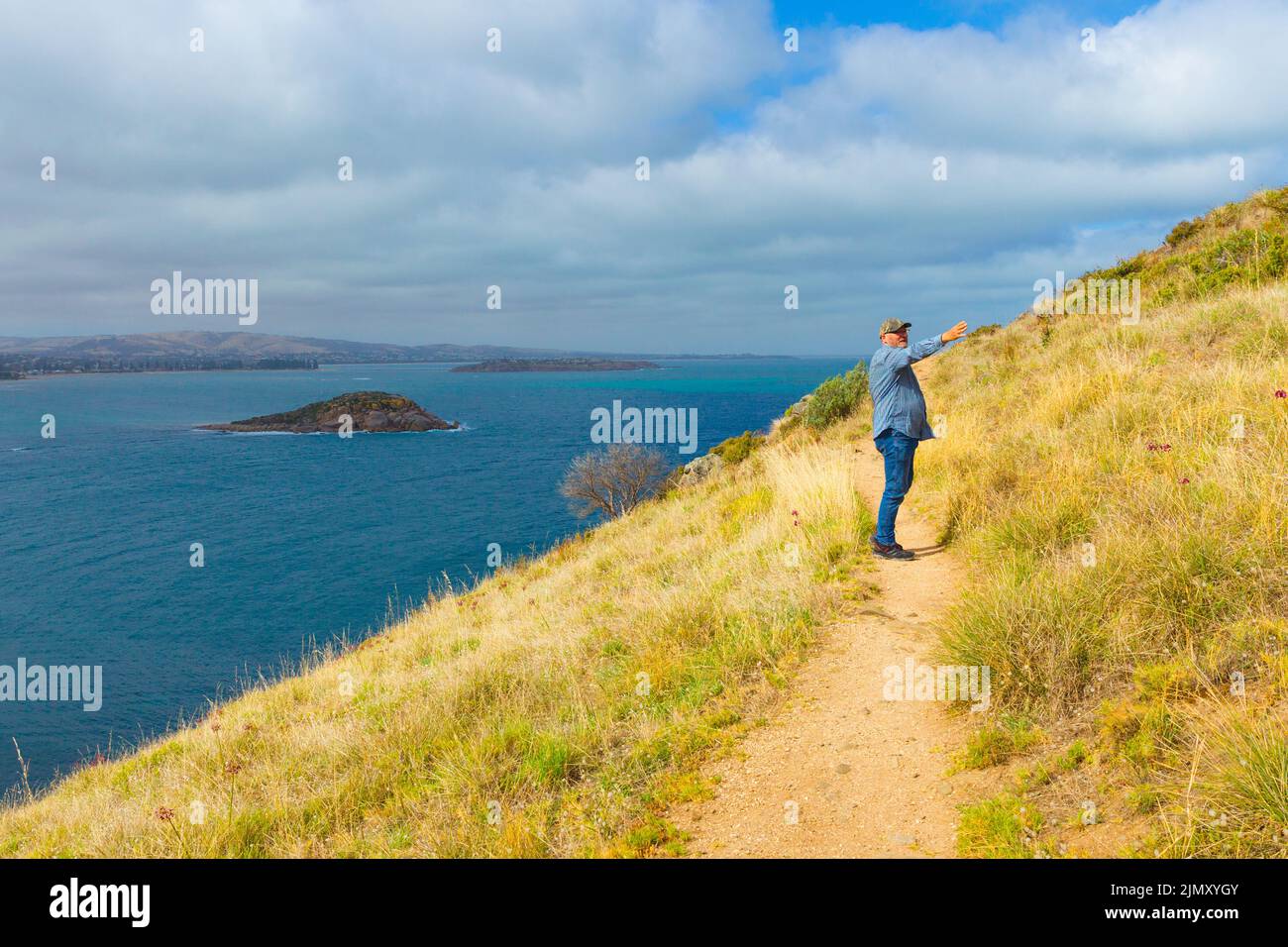 Andrew McIntyre, a resident of Adelaide in South Australia, pictured at the Rosetta Head bluff on Encounter Bay in Victor Harbor, South Australia. Stock Photo