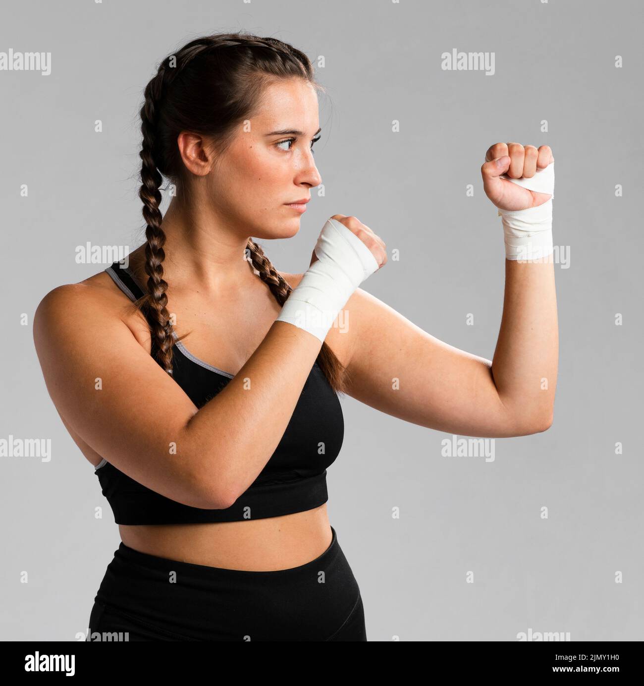 Side view fit woman combat position Stock Photo