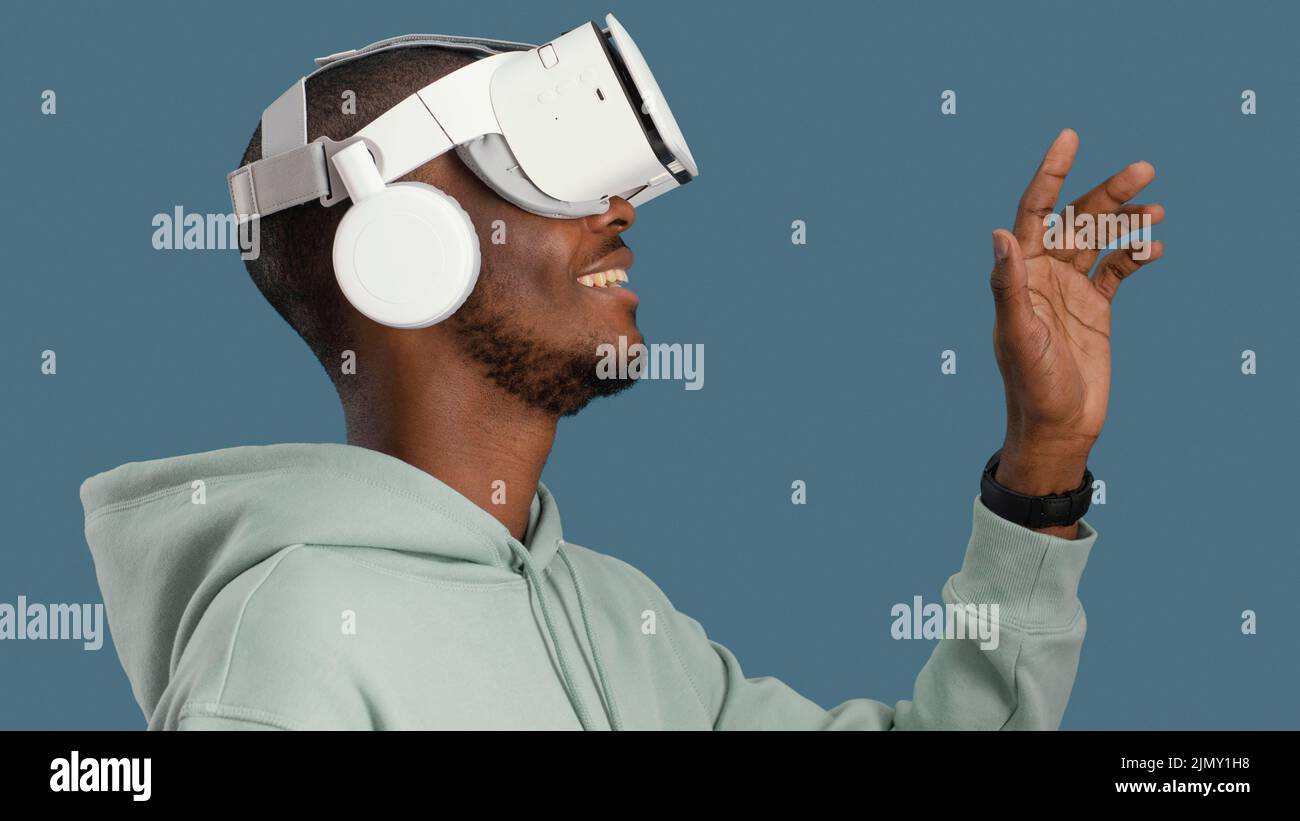 Side view smiley man with virtual reality headset Stock Photo