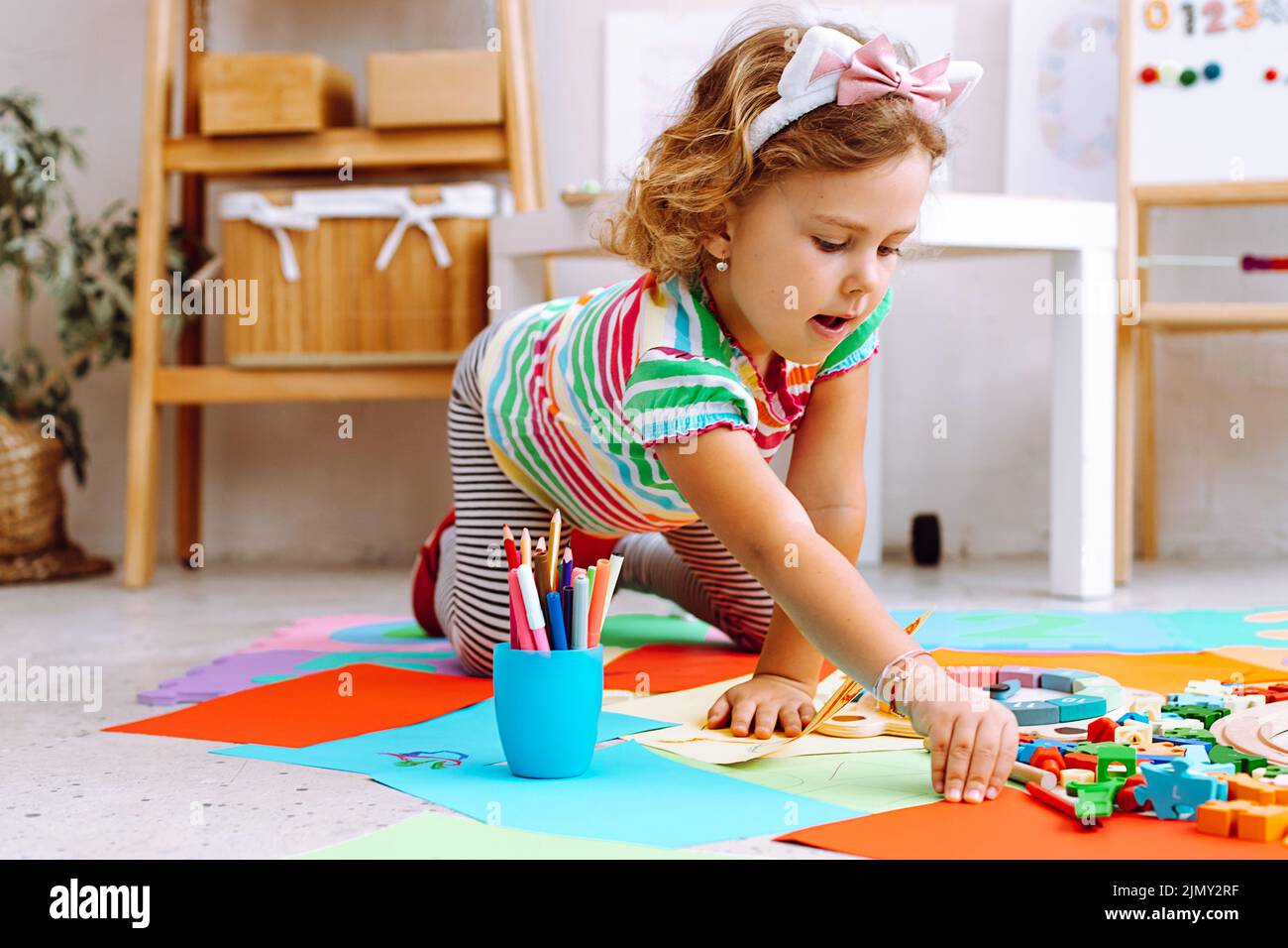 Kids drawing on white sheet of paper with crayon,closeup Stock Photo - Alamy