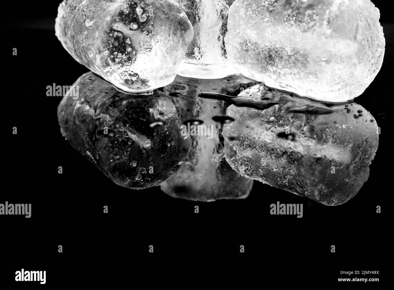 Big Ice cubes and reflections on black background Stock Photo Alamy
