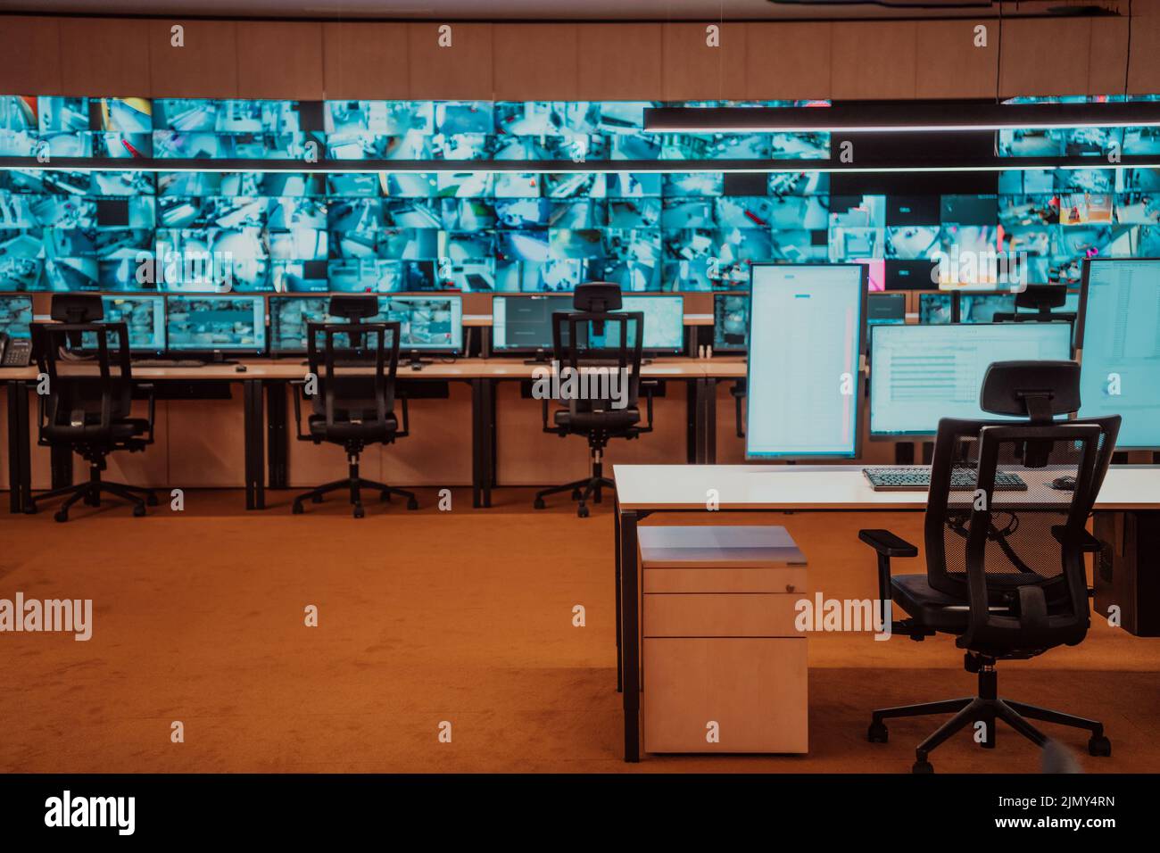 Security Room Dim Empty interior of big modern security system control room, workstation ...
