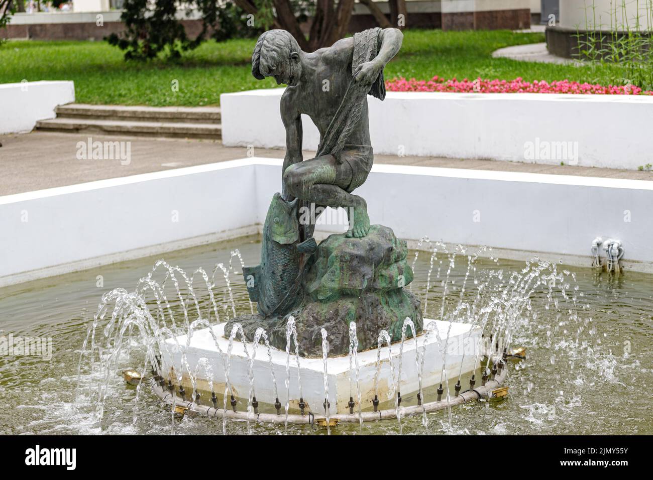 Garden with small fountain. Decoration of a small fountain with a