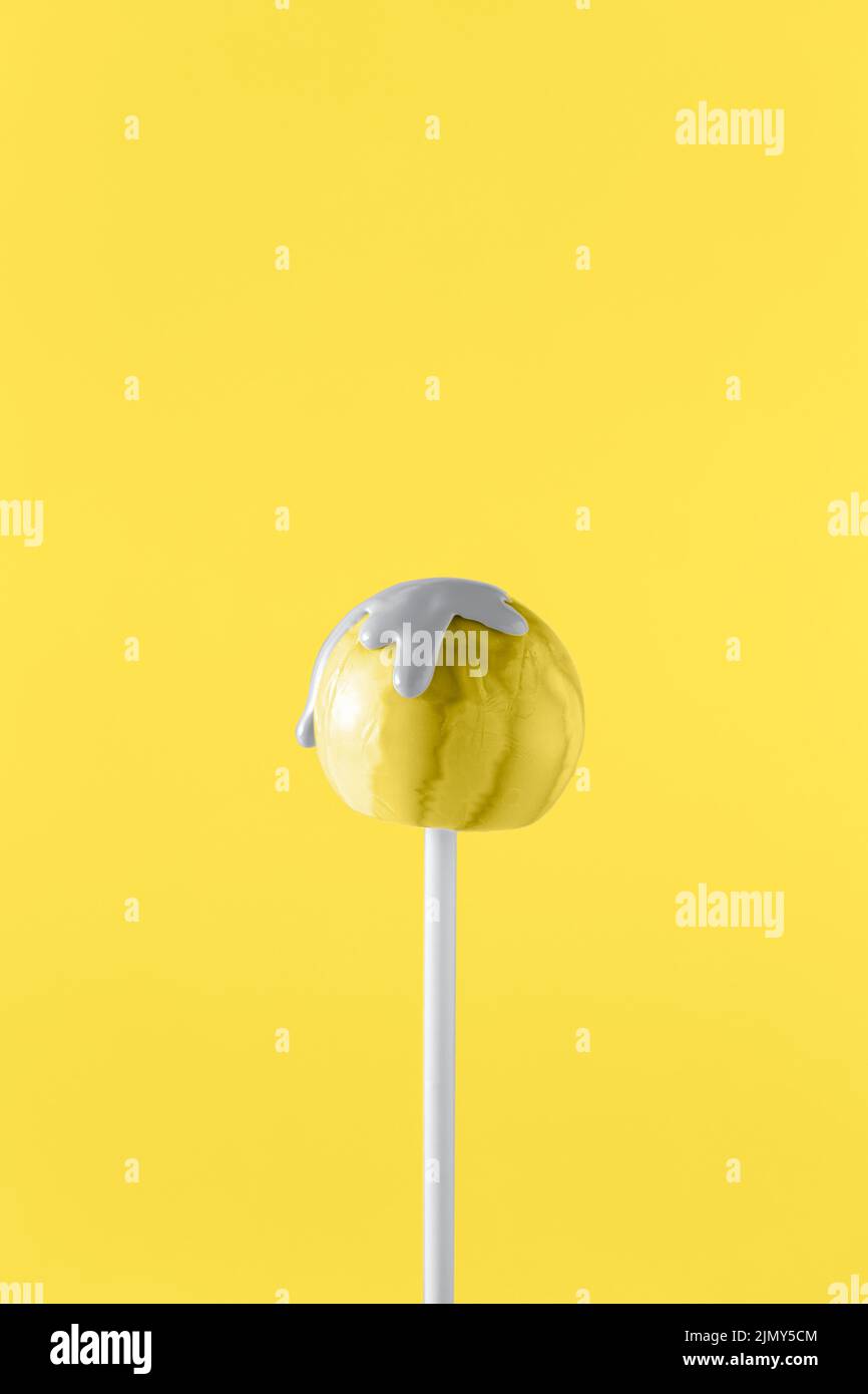 Illuminating colored lollipop with ultimate gray paint Stock Photo