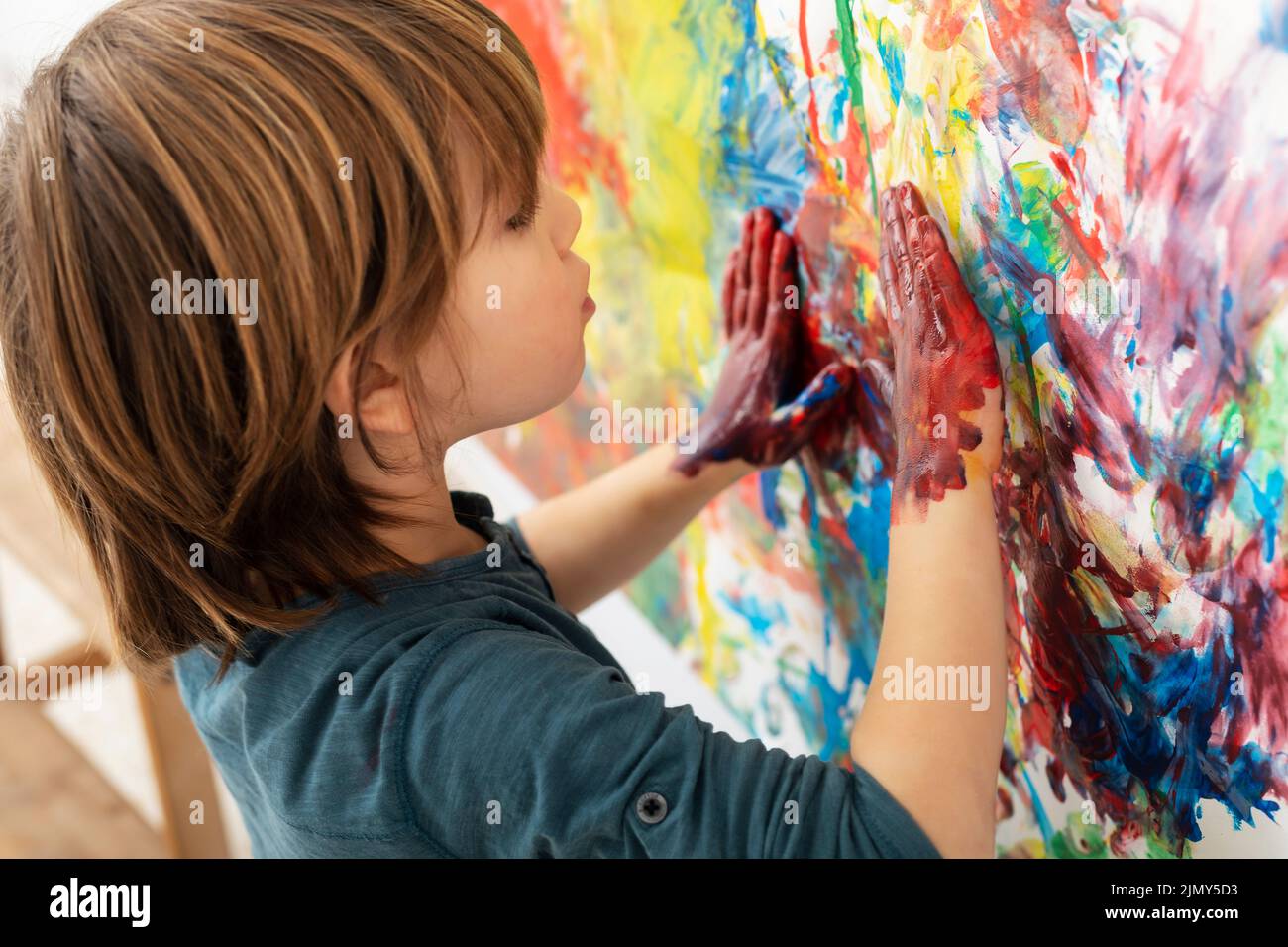 Little boy home painting Stock Photo