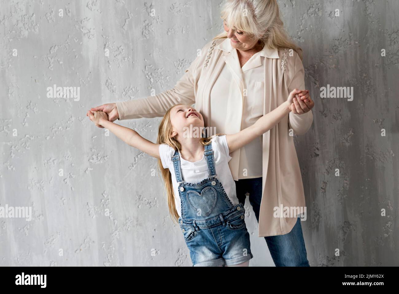 Grandma with little girl having fun Stock Photo - Alamy