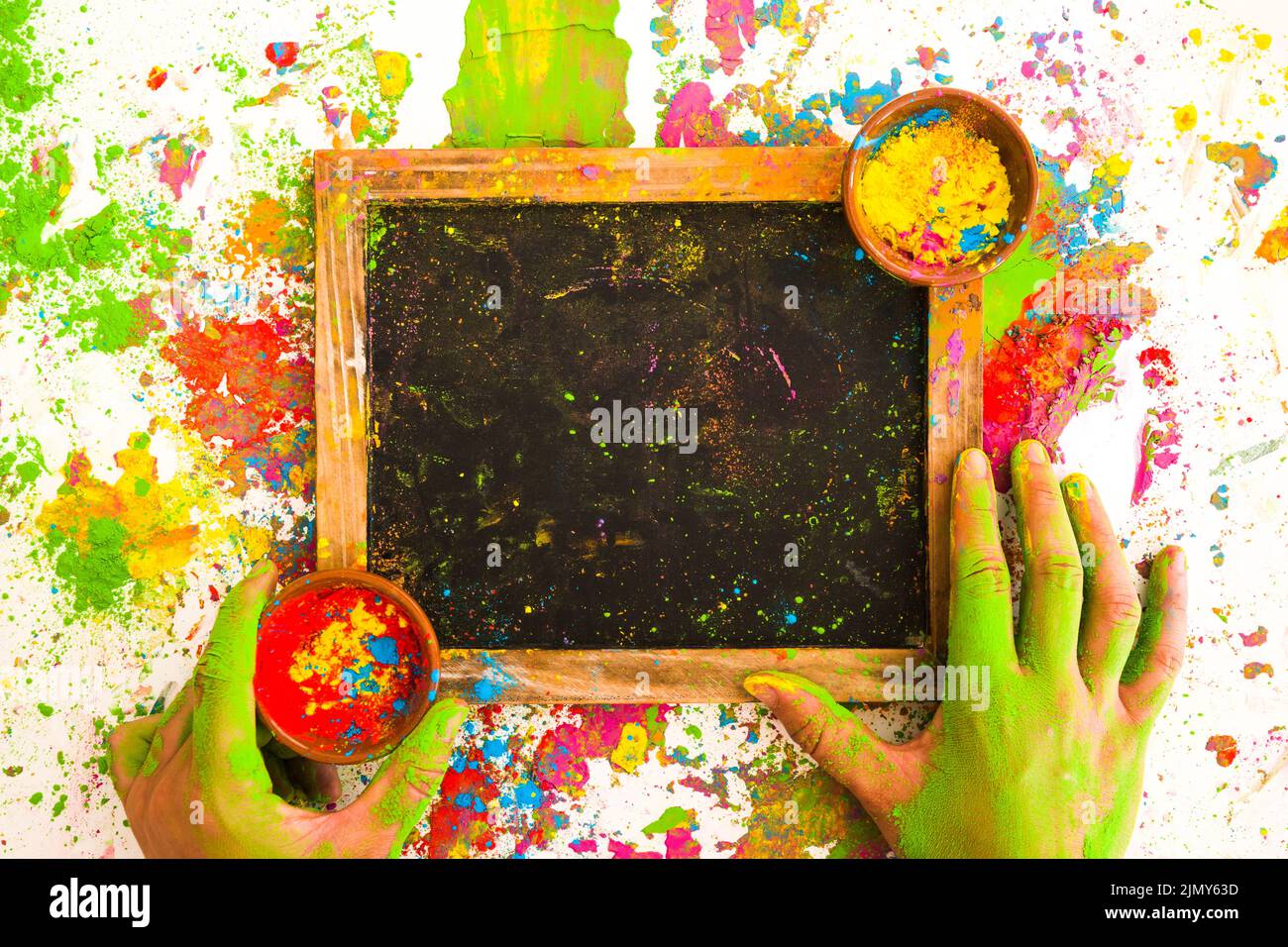 Hands near frame with colours bowls bright dry colors Stock Photo