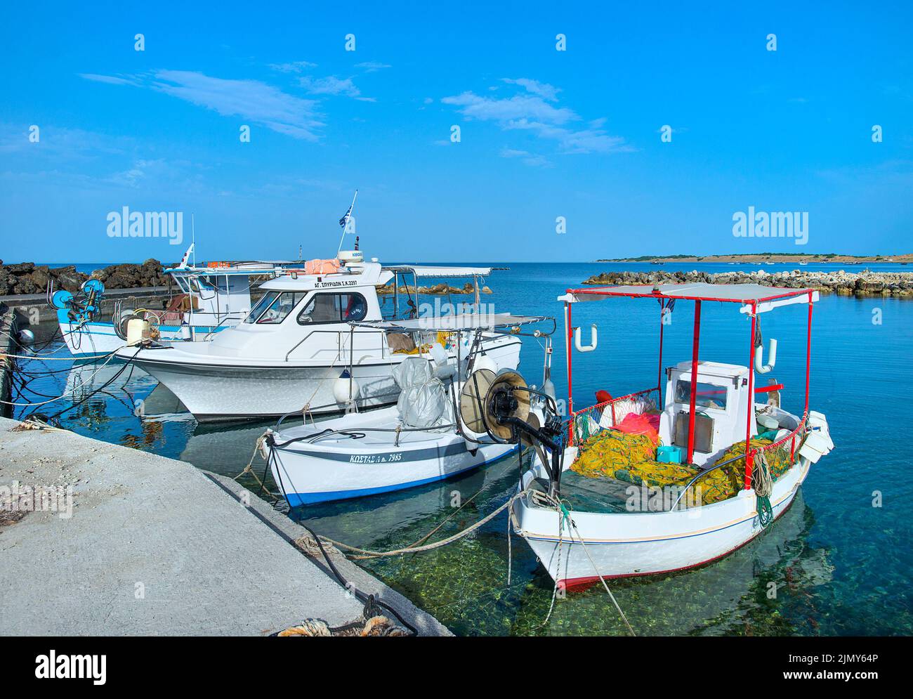 Fishing boats in harbour at Agios Georgios, Issos, Corfu, Ionian islands, Greece Stock Photo