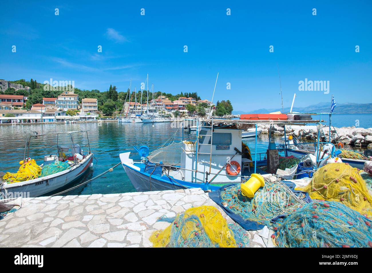 Kassiopi Harbour with fishing boats, Corfu, Ionian islands, Greece Stock Photo