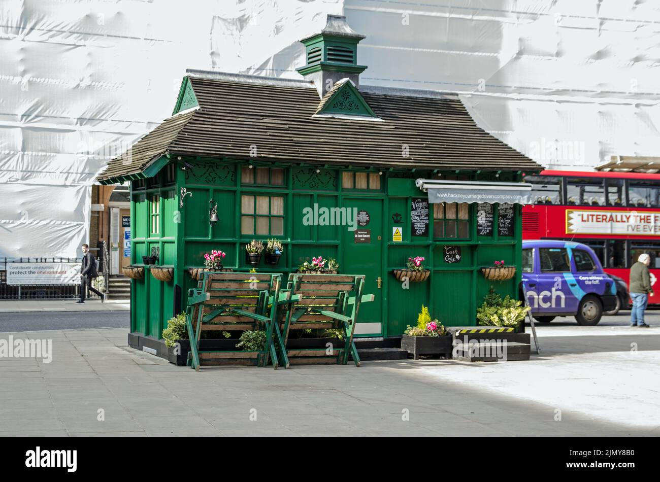 London, UK - March 21, 2022: An historic catering hut or Cabmen's Shelter built to provide drivers of black taxis with refreshments on the corner of R Stock Photo