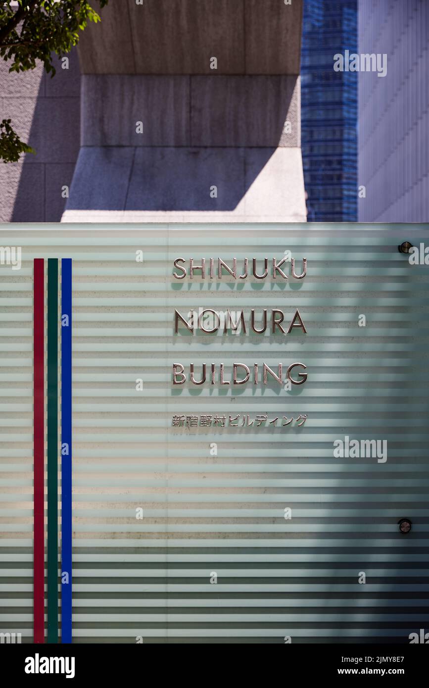 Shinjuku Nomura Building, sign outside building; Shinjuku, Tokyo, Japan Stock Photo