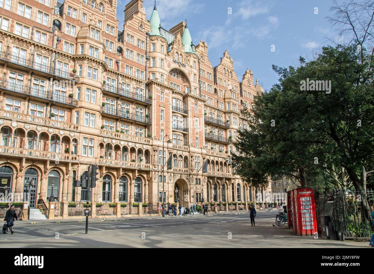 London, UK - March 21, 2022: View across a corner of Russell Square looking at the facade of the Kimpton Fitzroy Hotel, formerly the Hotel Russell, in Stock Photo