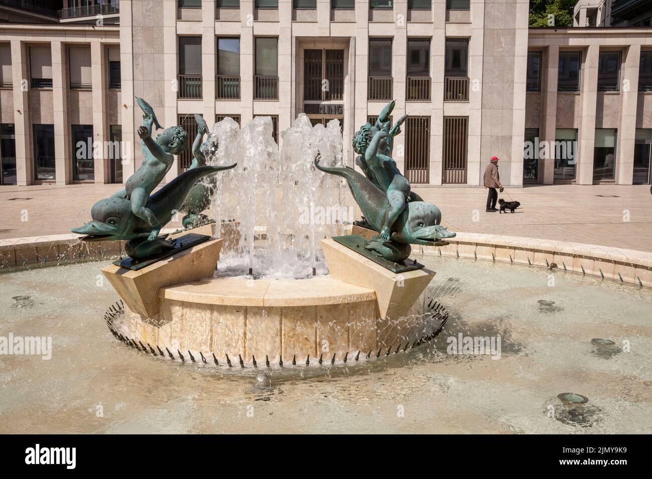 the Gerling Quartier, fountain with four boys riding on dolphins by artist Arno Breker at the Gereonshof, Cologne, Germany. das Gerling Quartier, Brun Stock Photo