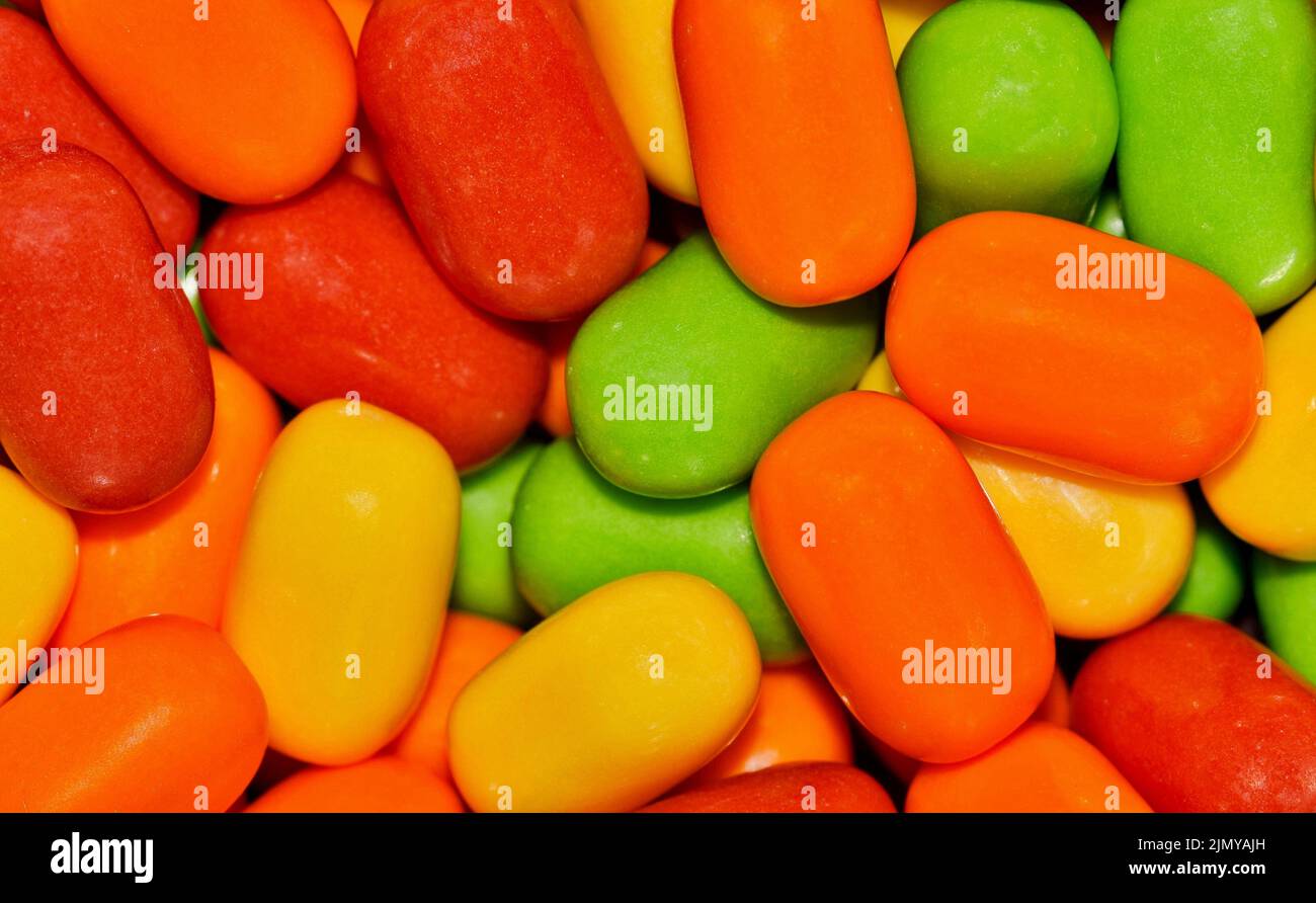 Colorful candy background, vibrant multi color candies, macro full frame image. Stock Photo
