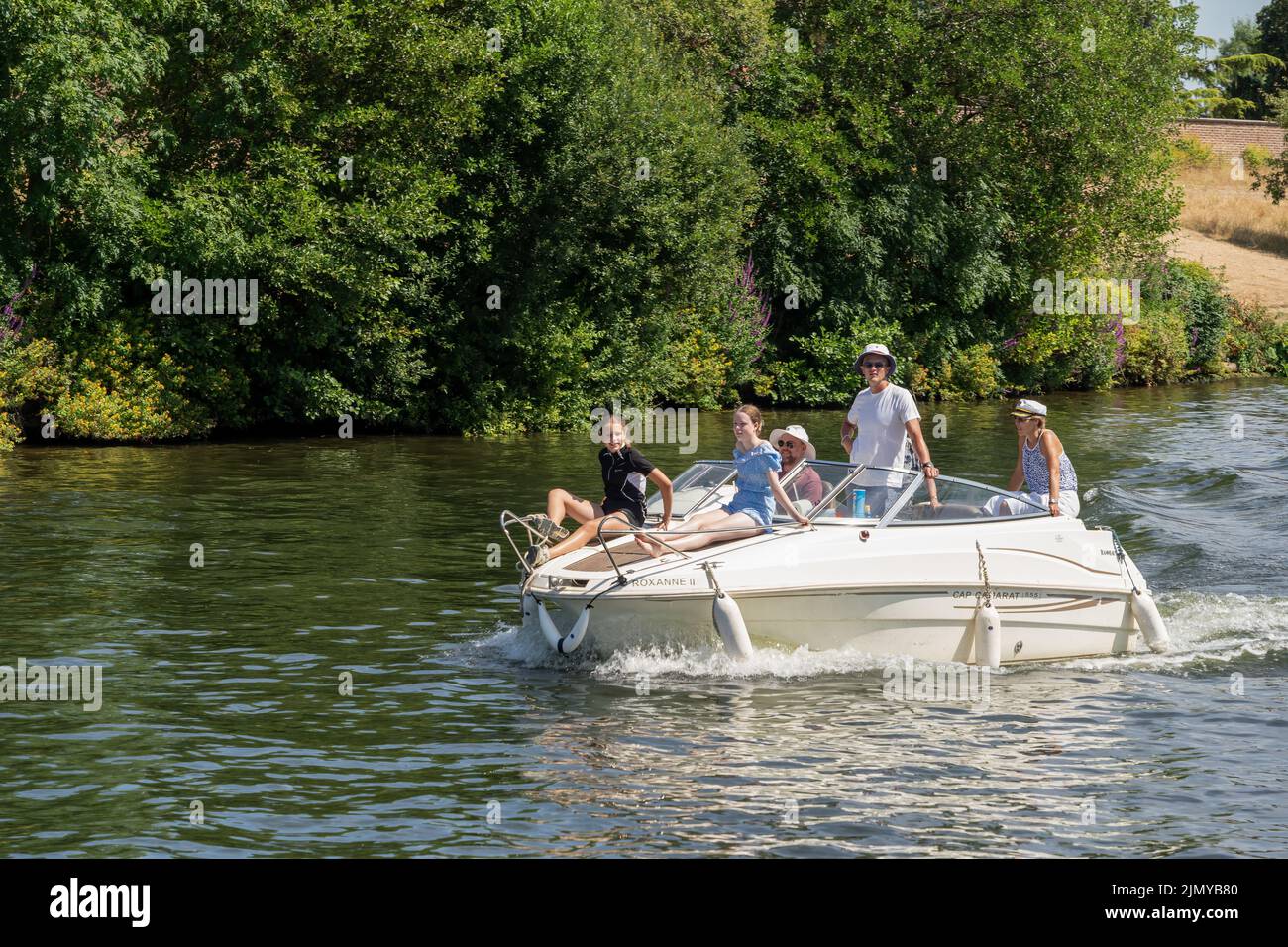 Thames Ditton Surrey, UK - July 15, 2022 : People cruising along the River Thames at Thames Ditton on July 15, 2022. Unidentified people Stock Photo