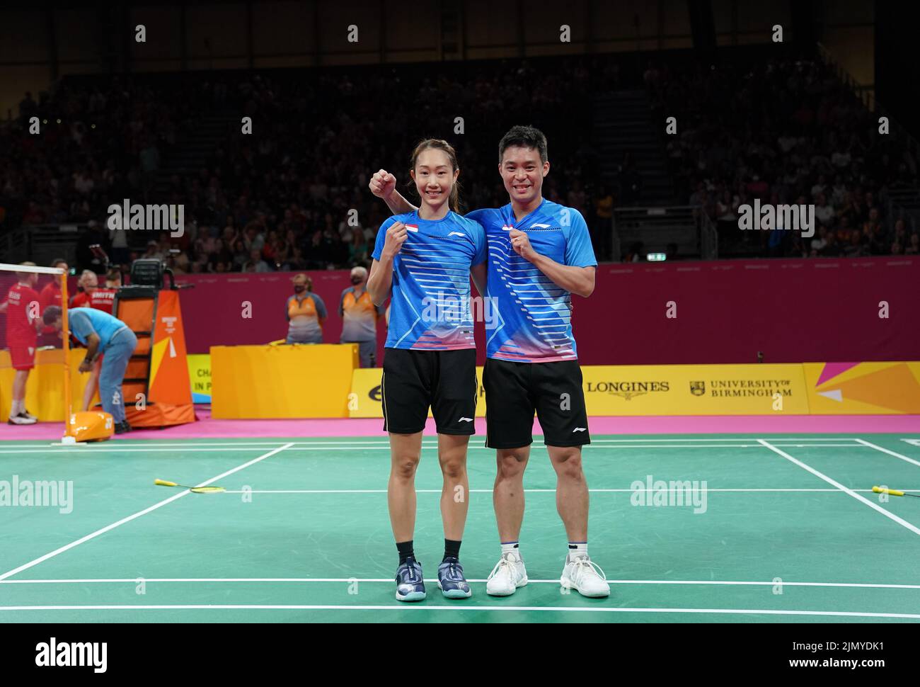 Singapore's Jessica Tan and Yong Hee celebrate after winning the Mixed
