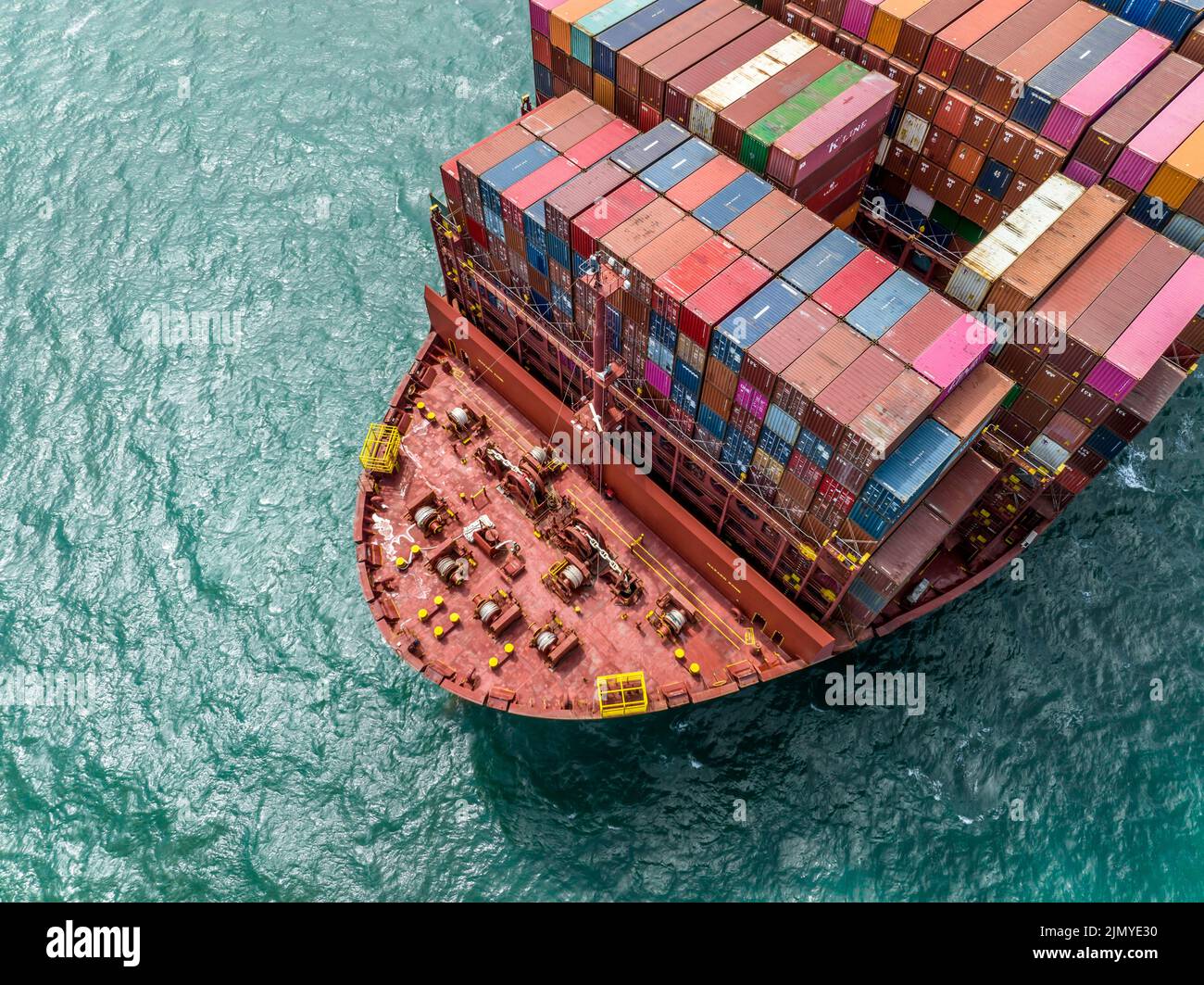 Huge Container Ship at Sea Transporting Goods and Cargo to International Ports Stock Photo