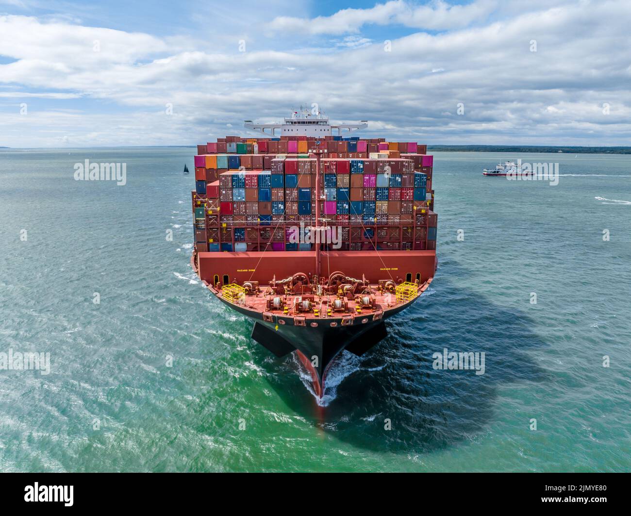 Huge Container Ship at Sea Transporting Goods and Cargo to International Ports Stock Photo