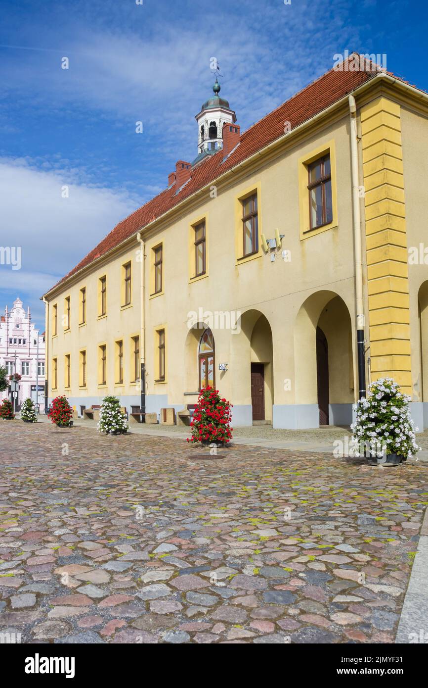 Cobblestones in front of the historic town hall in Trzebiatow, Poland Stock Photo