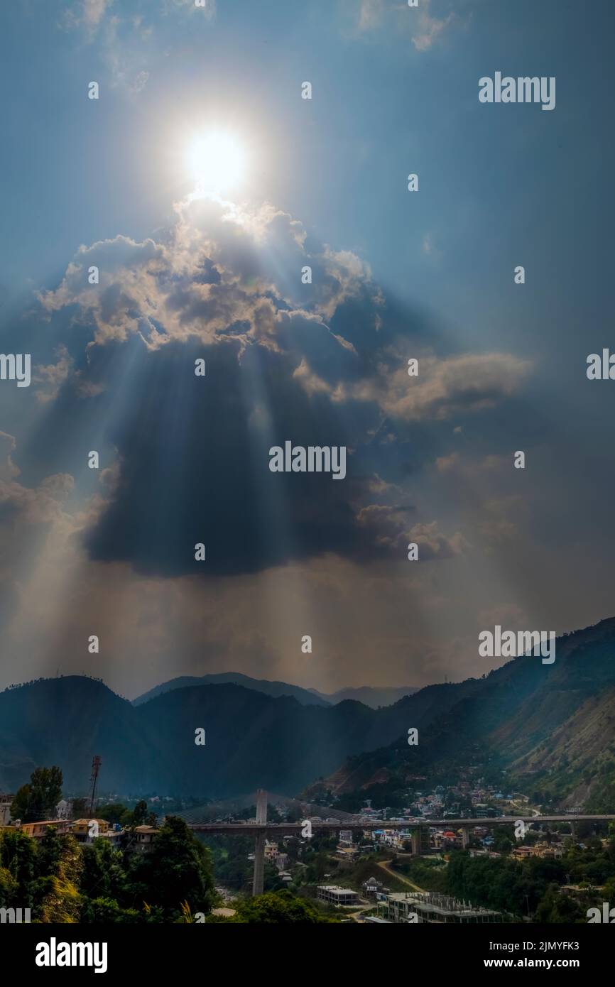 sun rays and clouds in the blue sky Stock Photo