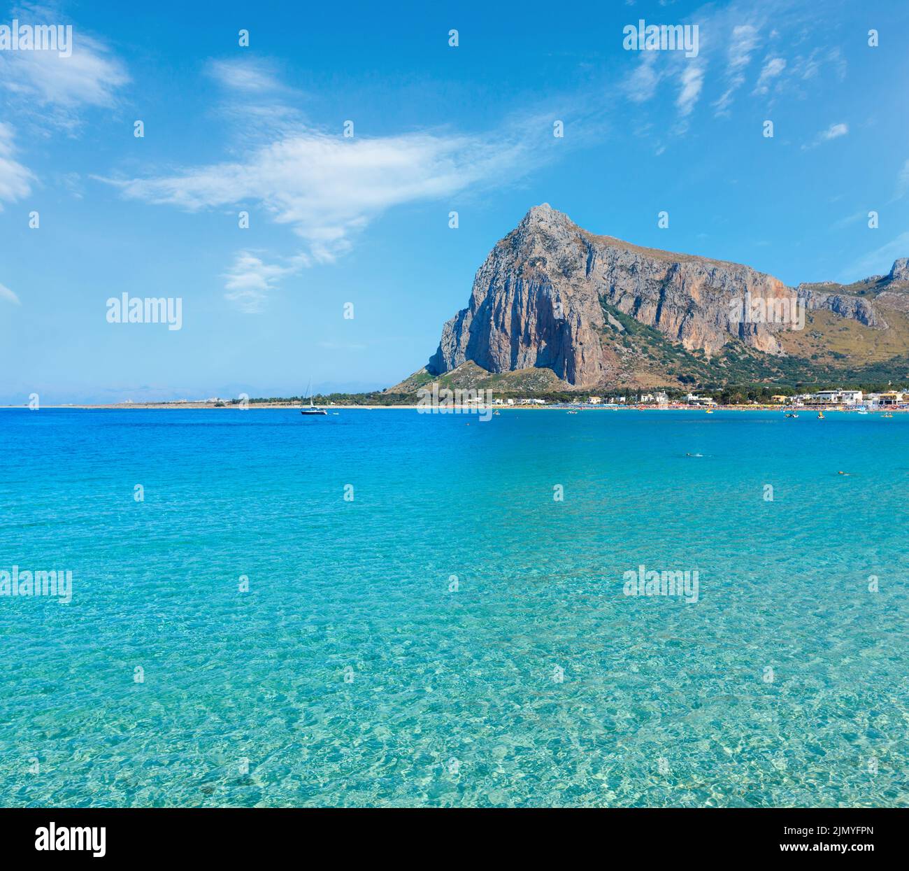 Paradise Tyrrhenian sea bay, San Vito lo Capo beach with clear azure water and extremally white sand, and Monte Monaco in far, S Stock Photo