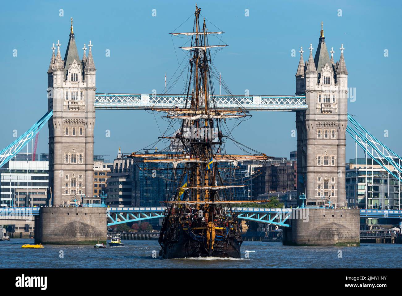 Tower Bridge, London, UK. 8th Aug, 2022. Gotheborg of Sweden is a sailing replica of the Swedish East Indiaman Gotheborg I, launched in 1738, and is visiting London to welcome visitors on board. The wooden replica ship was launched in 2003 and last visited London in 2007. It has navigated up the River Thames in the morning to pass under the opened Tower Bridge before turning and passing back under and heading for Thames Quay in Canary Wharf, where it will be open to visitors. Heading down river after passing under Tower Bridge Stock Photo