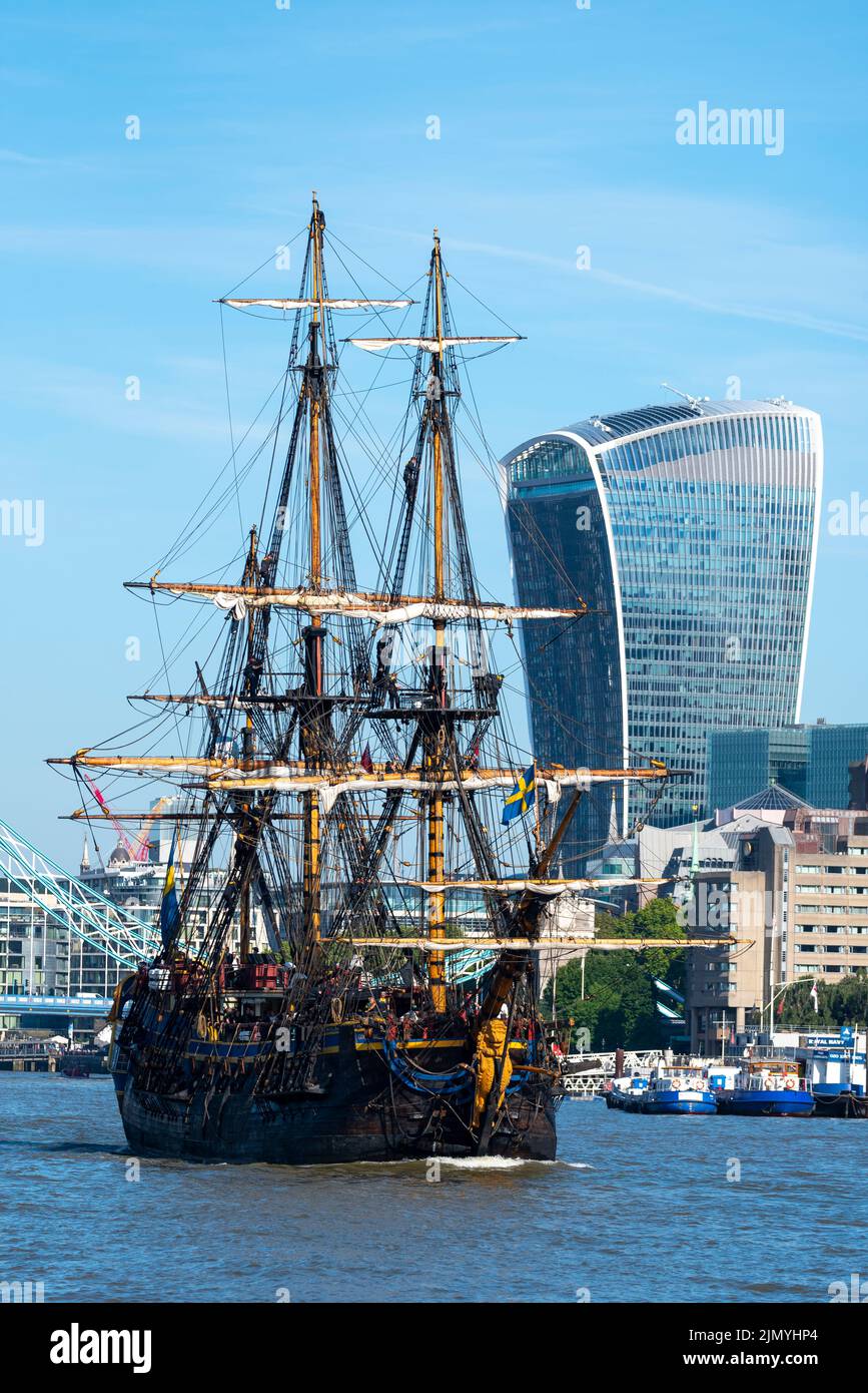 Tower Bridge, London, UK. 8th Aug, 2022. Gotheborg of Sweden is a sailing replica of the Swedish East Indiaman Gotheborg I, launched in 1738, and is visiting London to welcome visitors on board. The wooden replica ship was launched in 2003 and last visited London in 2007. It has navigated up the River Thames in the morning to pass under the opened Tower Bridge before turning and passing back under and heading for Thames Quay in Canary Wharf, where it will be open to visitors. Passing 20 Fenchurch Street building, nicknamed Walkie Talkie, in the financial district Stock Photo