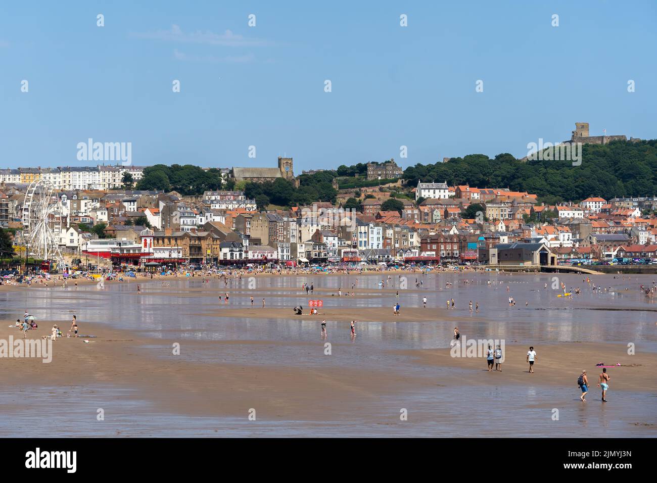SCARBOROUGH,  NORTH YORKSHIRE, UK - JULY 18: View of the sea front in Scarborough, North Yorkshire on July 18, 2022. Unidentifie Stock Photo