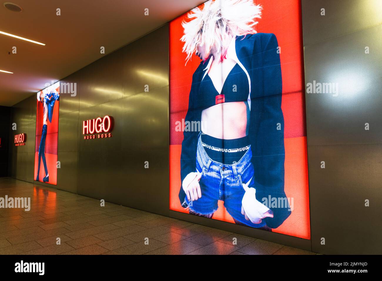Hugo Boss advertisement on the wall of the store. Kaunas, Lithuania, 22 June 2022 Stock Photo