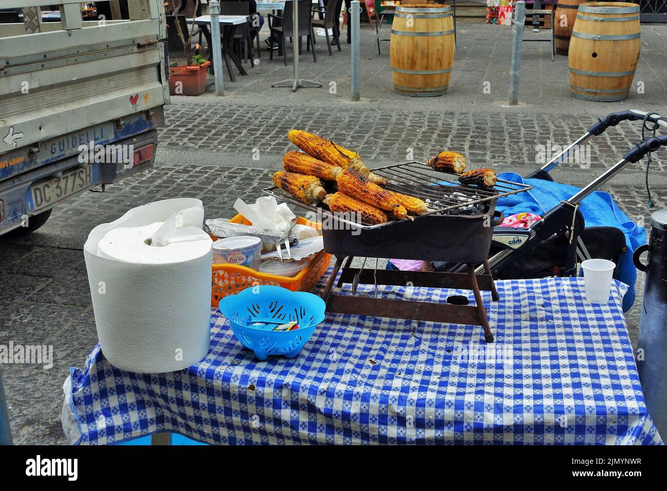 Roasted corn vendor, grilled maize hawker, Naples, Campania, Italy