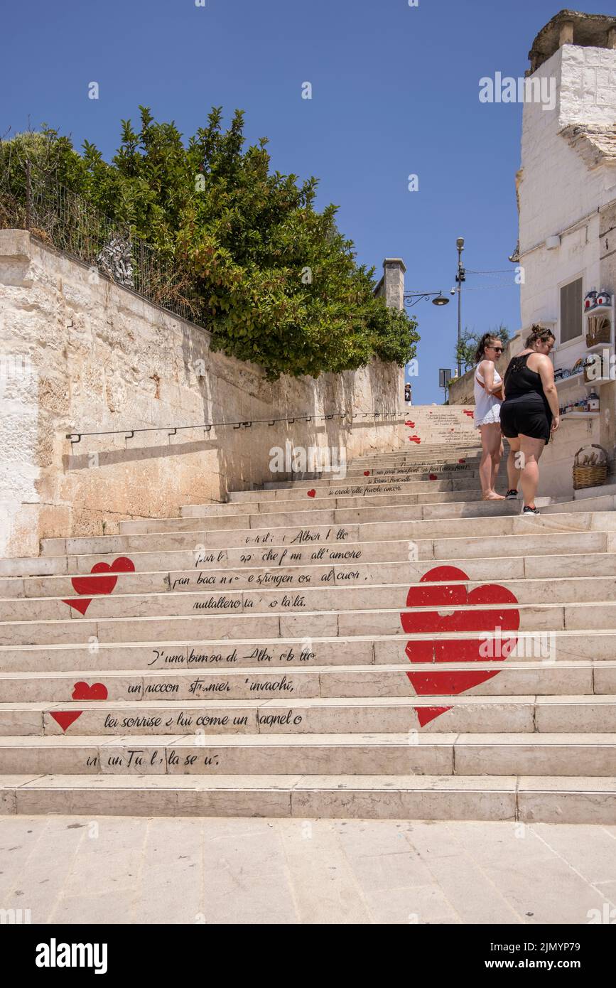 hearts decorate the many stairs and steps in locorotondo a town in puglia italy famous for its circular cone shaped  trulli houses Stock Photo