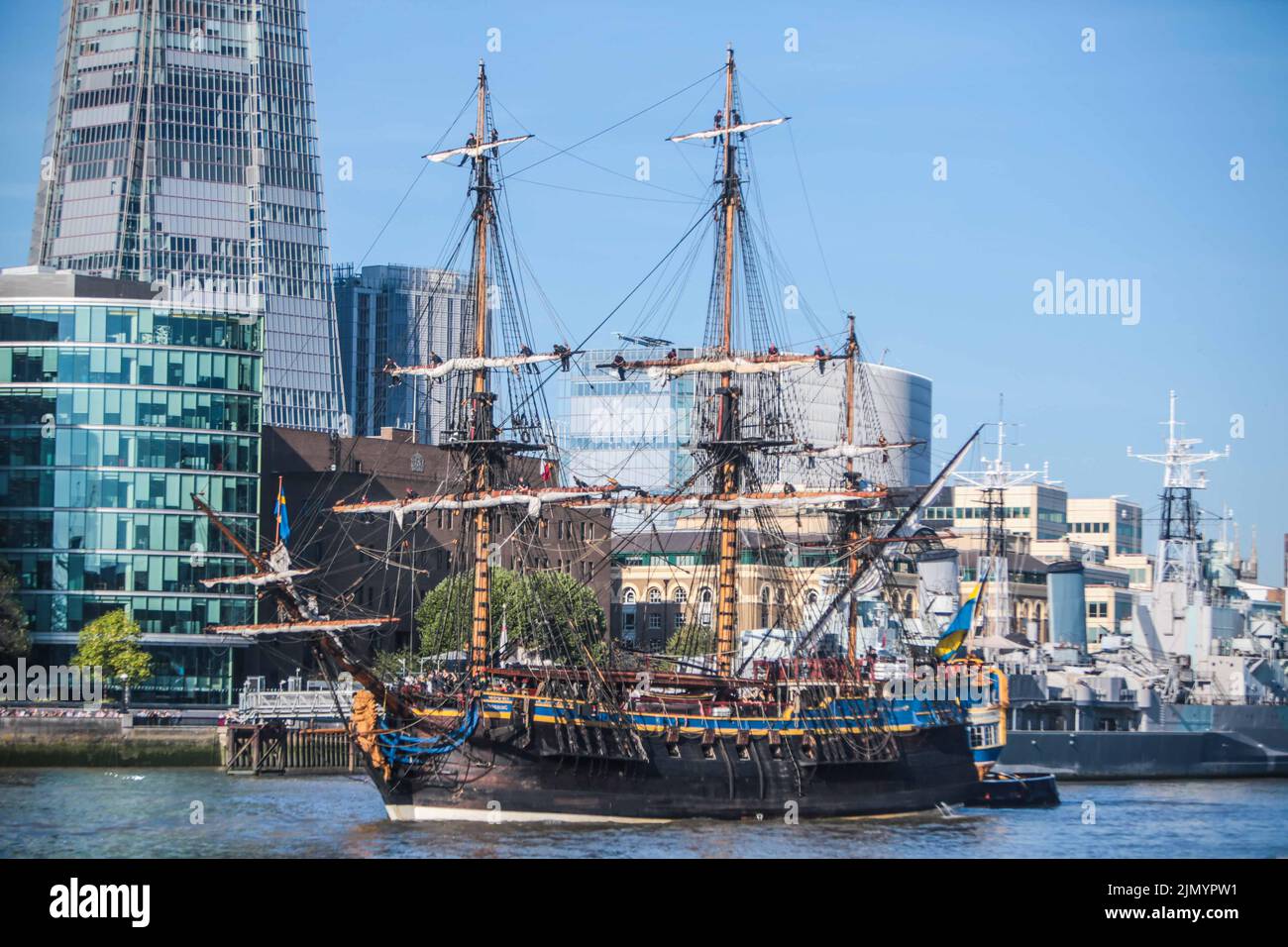London UK 8 August 2022 Replica 18th century Swedish ship Götheborg sailed into London today.Sailors can be seen on top of the sails . The world's largest ocean-going wooden sailing ship passed through the elevated Tower Bridge,  fifteen years after  the ship last visited London. She will be docked at South Dock Quay in Canary Wharf. Open to visitors every day of the stopover. Paul Quezada-Neiman/Alamy Live News Stock Photo