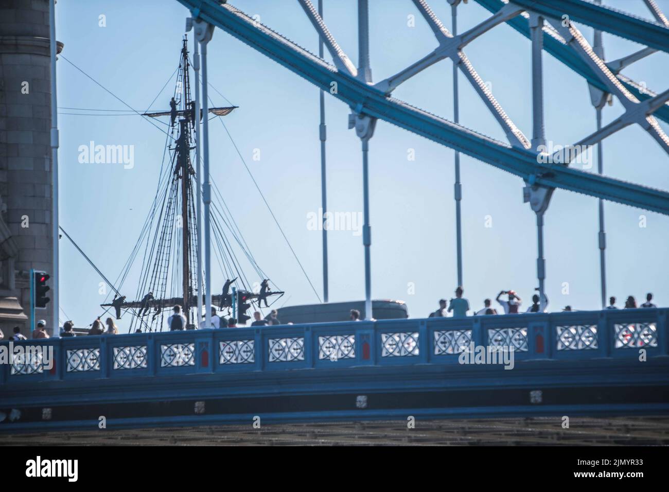 London UK 8 August 2022 Sailors wave to the crowds who gathered in Tower Bridge , to see  The world's largest ocean-going wooden sailing ship passed through the elevated Tower Bridge,  Paul Quezada-Neiman/Alamy Live News Stock Photo