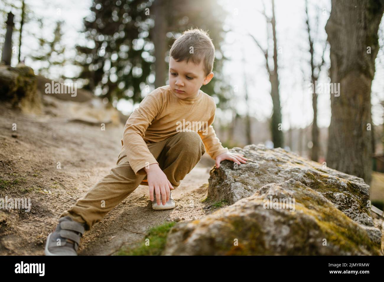 Portrait of cute curious little boy in nautre, autumn concept. Stock Photo