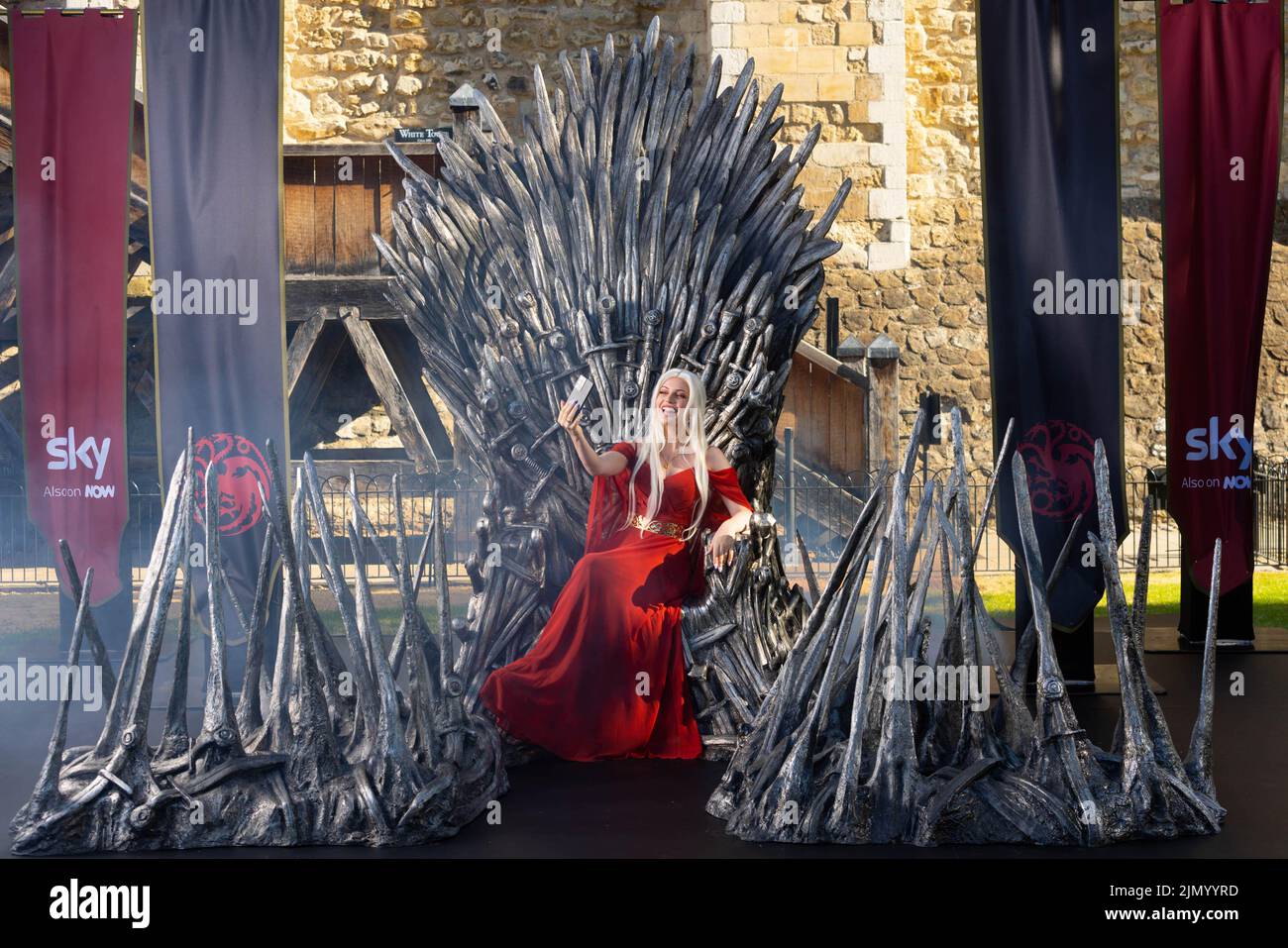 EDITORIAL USE ONLY Cosplayer and super fan Sophia sits on the Iron Throne outside the Tower of London to mark the launch of the Game of Thrones prequel, House of the Dragon, airing on Sky and streaming service NOW from August 22. PA PHOTO Picture date: Monday August 8, 2022.. The throne is being displayed at the Tower of London today and tomorrow, ahead of the House of the Dragon premiere next week in Leicester Square. Fans and Visitors to the Tower of London will be able to discover more about the news series via a QR code next to the Iron Throne. The Throne will then be touring the country,  Stock Photo