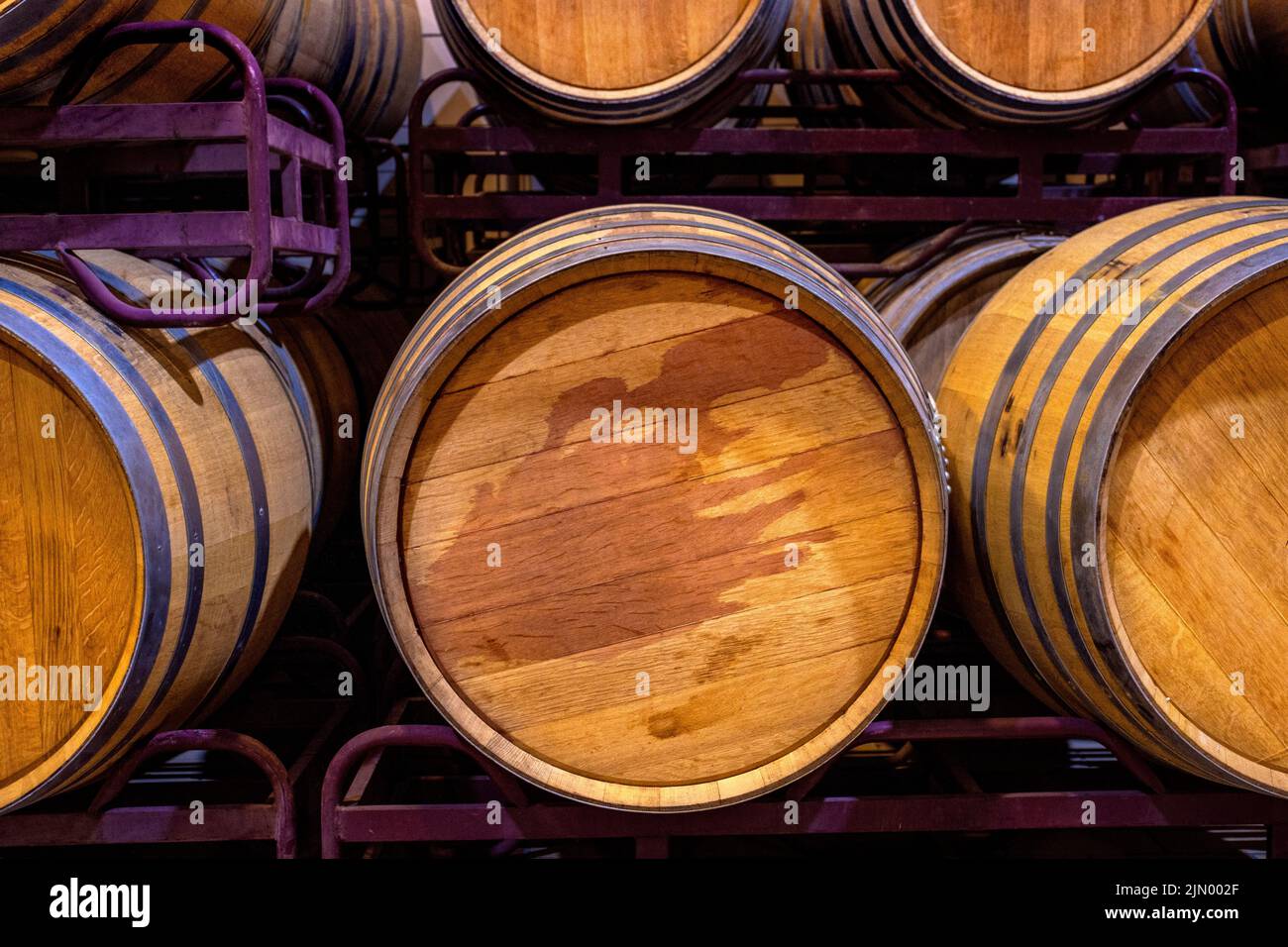 Wooden wine barrels stored underground Stock Photo Alamy
