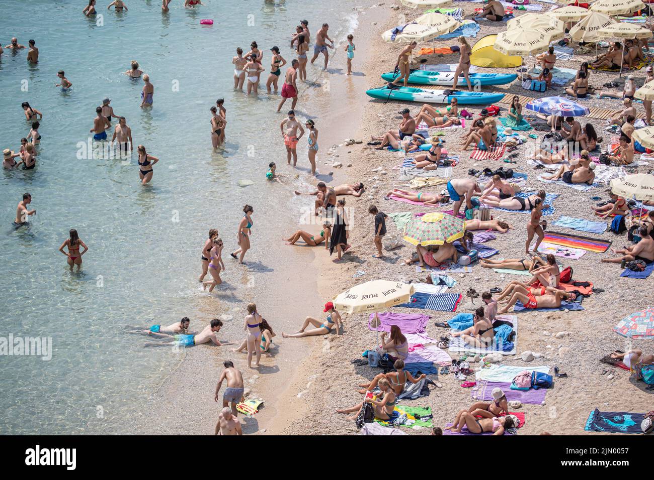 Tourists At Banje Beach Sought Refreshment From The High Temperatures In Dubrovnik Croatia On