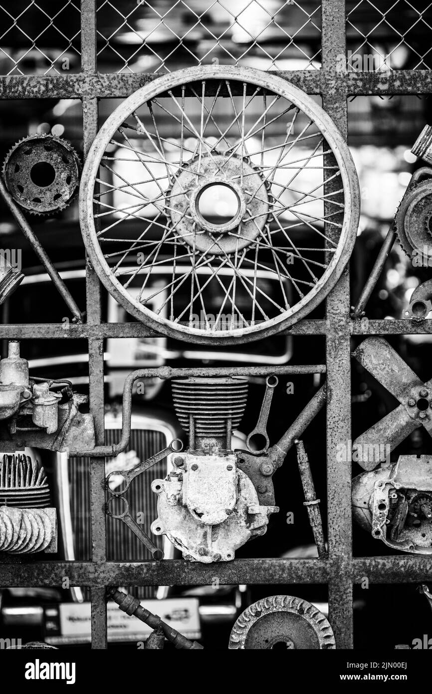 Metal scrap installation made of old cars and motorcycles parts Stock Photo