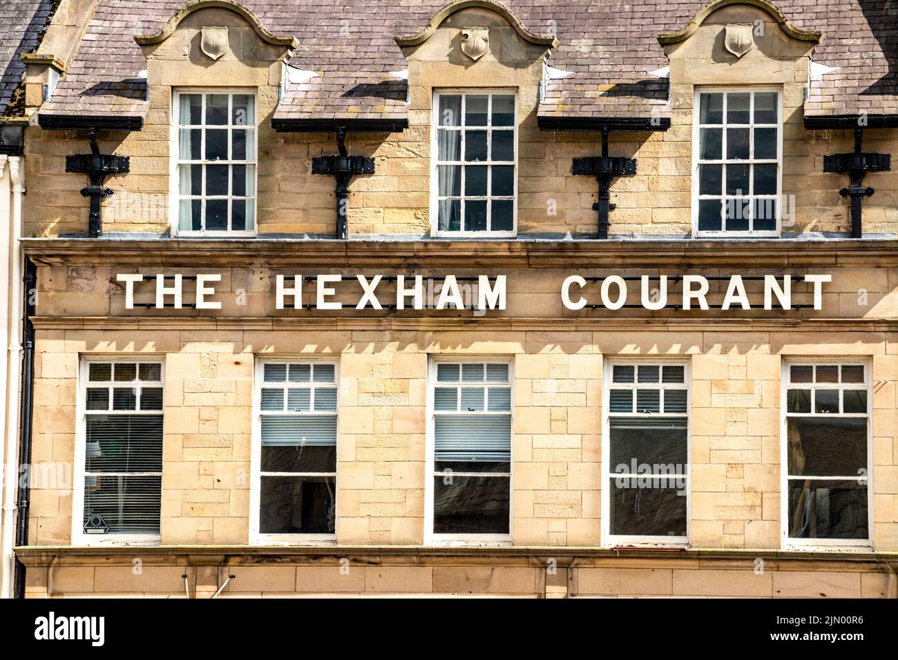 sign for the Hexham courant local newspaper offices in Hexham Northumberland Stock Photo