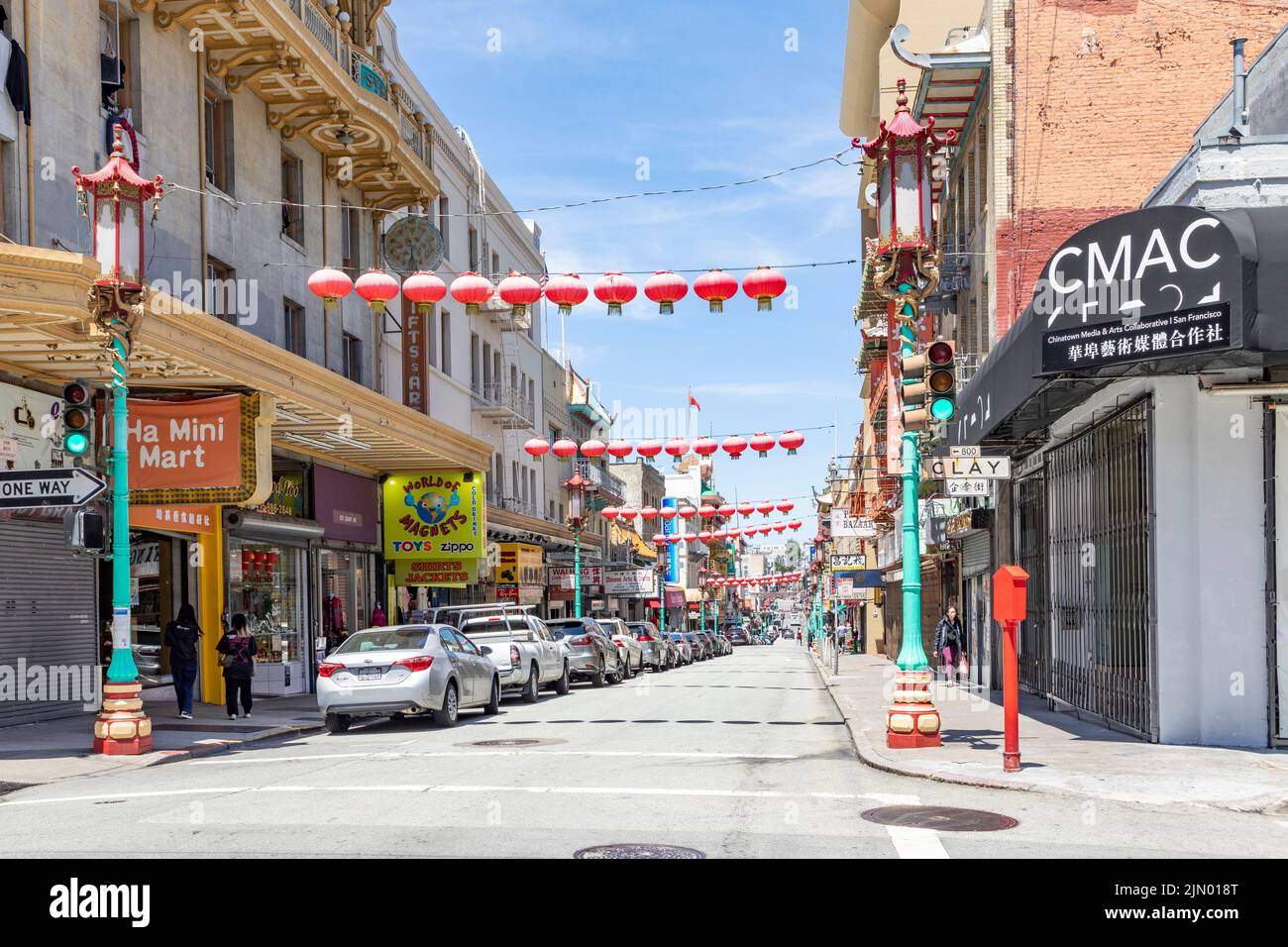 San Francisco, USA - May 19, 2022: people visit  Chinatown in San Francisco with chinese restaurants, shops and streets with typical chinese lantern. Stock Photo