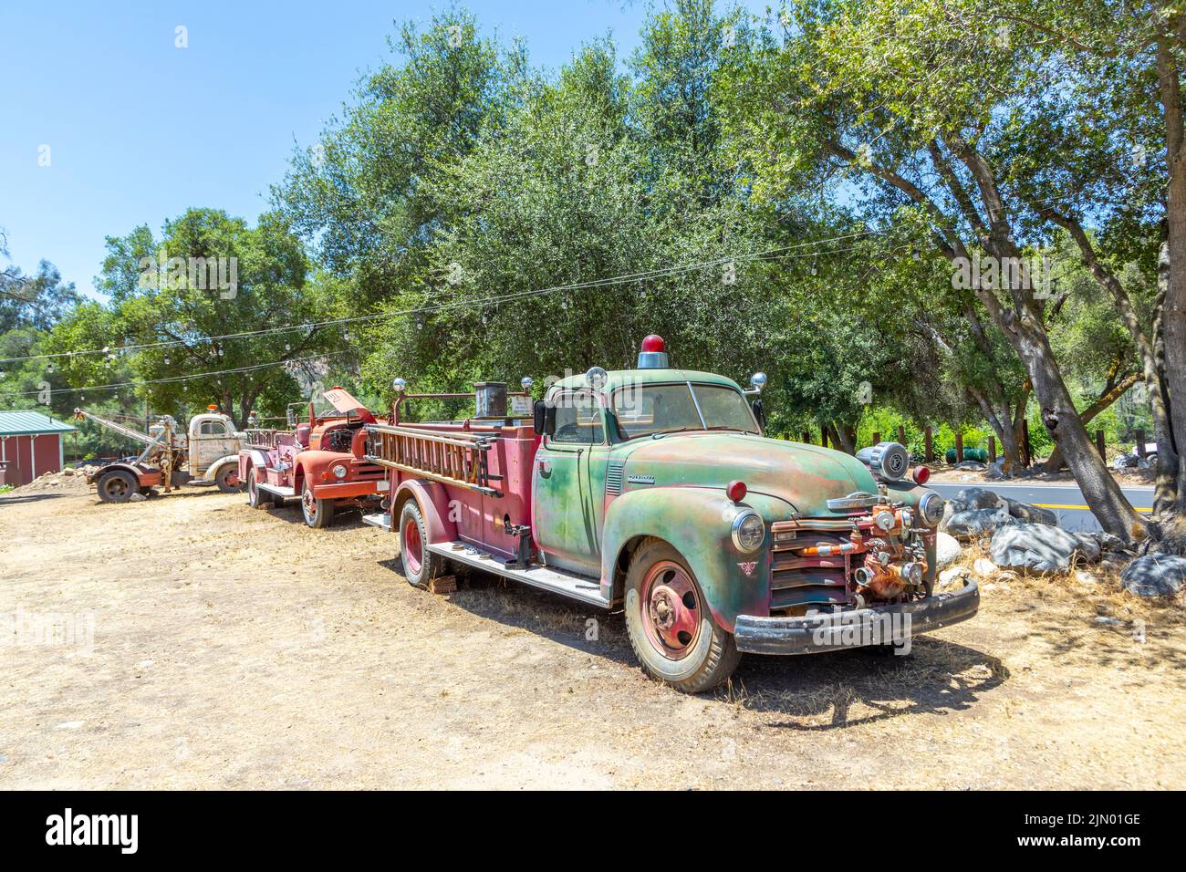 Three Rivers, USA - May 21, 2022: old vintage dirty  fire engine car at an outdoor loam parking lot in three rivers. Stock Photo