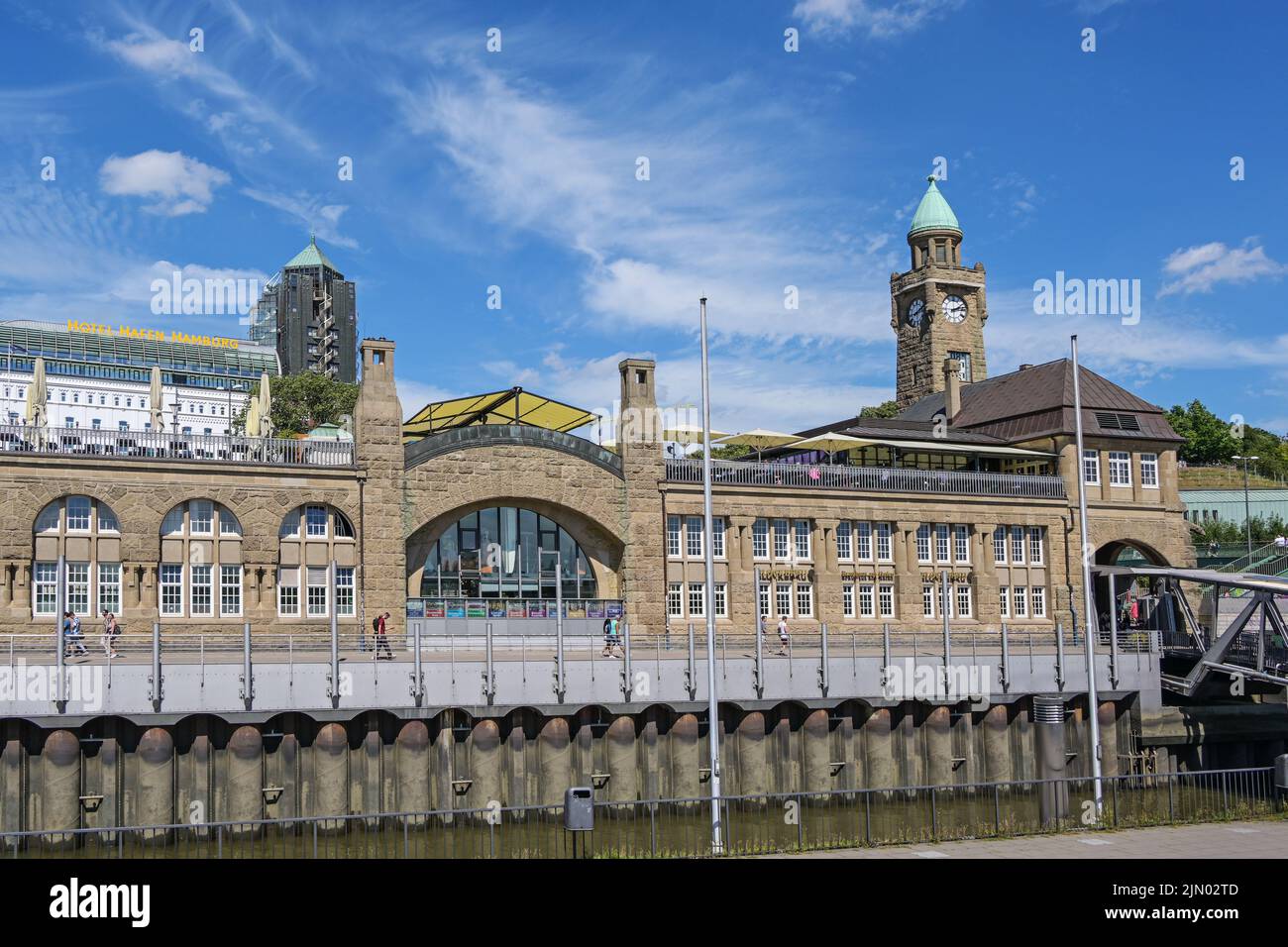 Hamburg, Germany, August 4, 2022: Landungsbruecken St. Pauli piers, terminal building with clock tower on the river Elbe, famous landmark and travel d Stock Photo