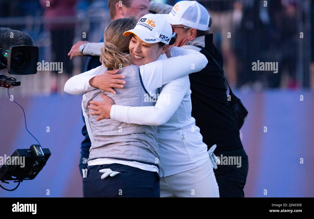 Gullane, Scotland, UK. 7th August 2022. Final  round of the AIG Women’s Open golf championship at Muirfield in Gullane, East Lothian. Pic; Ashleigh Buhai is congratulated and hugged by Chun In Gee after holing her winning putt after 4 play-off holes on the 18th green.   Iain Masterton/Alamy Live News Stock Photo