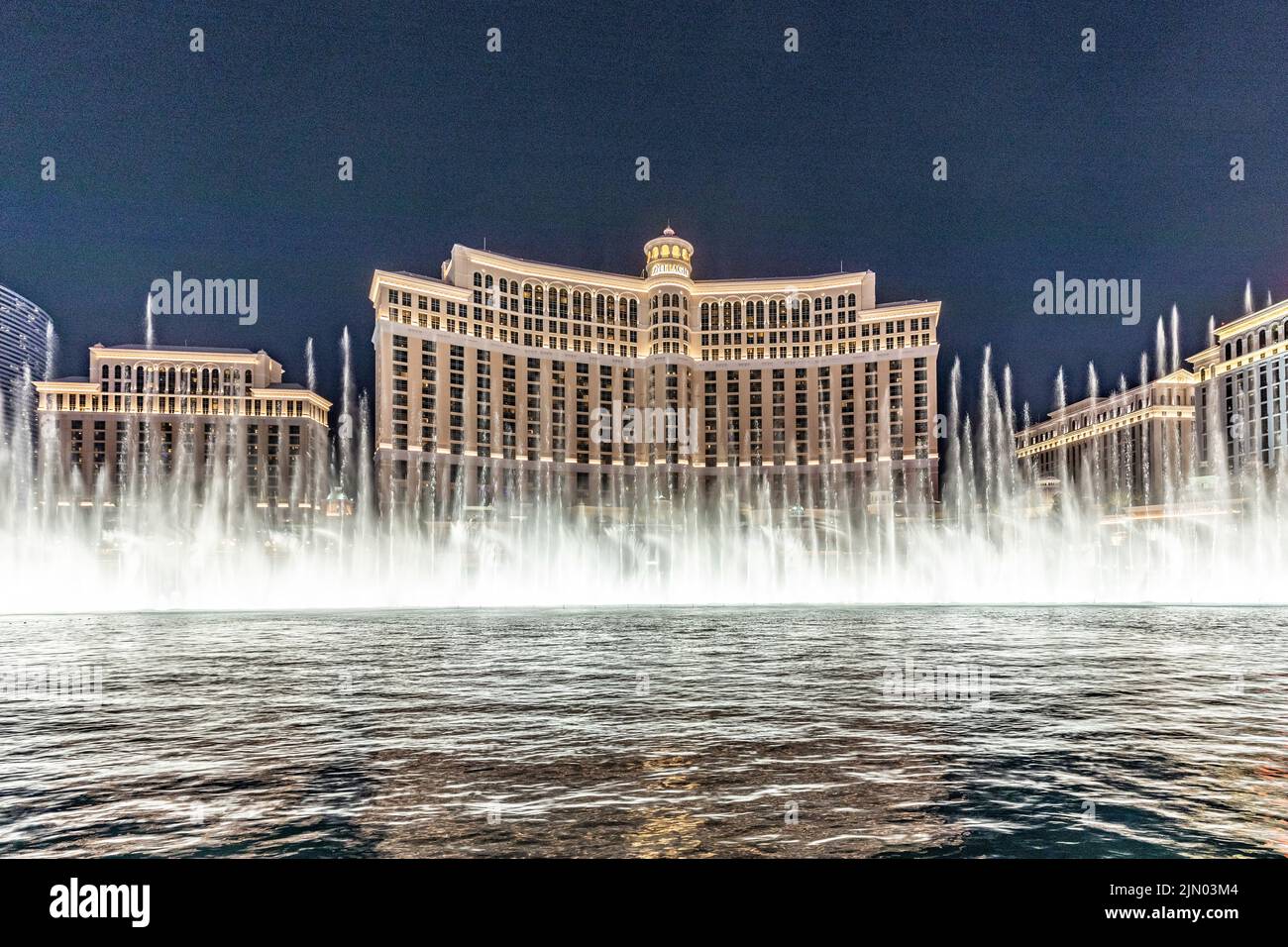 Las Vegas, Nevada, USA - May 23, 2022: The Fountains of Bellagio at night. This feature performs choreography with water, music and light in front of Stock Photo