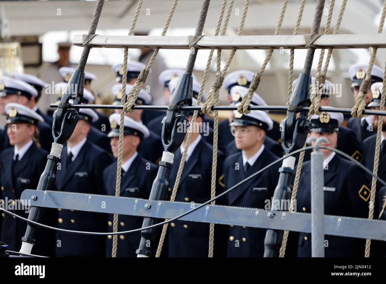 Kiel, Germany. 08th Aug, 2022. Crew members stand on board the 'Gorch Fock'. The sail training ship set off on a training voyage on August 8, 2022, and is expected back in its home port of Kiel at the end of September. Credit: Frank Molter/dpa/Alamy Live News Stock Photo