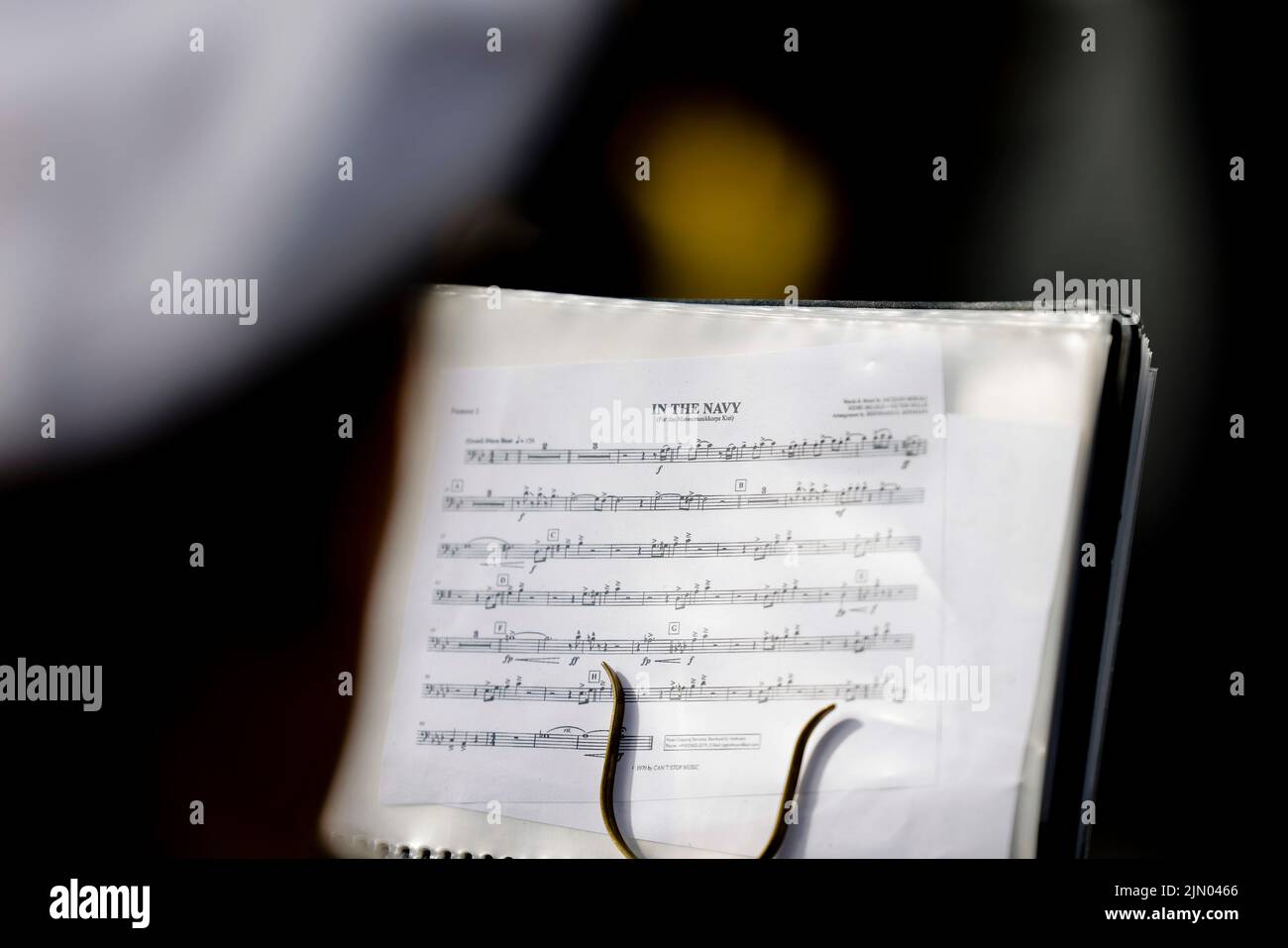 08 August 2022, Schleswig-Holstein, Kiel: A sheet of music of the song 'In the Navy' is attached to a music stand in front of the 'Gorch Fock'. The sail training ship set off on a training voyage on August 8, 2022, and is expected back in its home port of Kiel at the end of September. Photo: Frank Molter/dpa Stock Photo