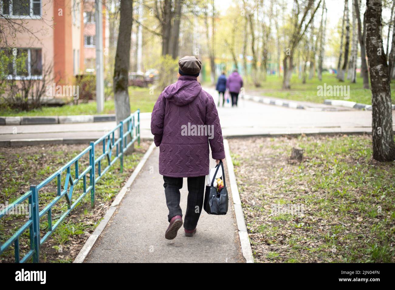 Happy smiling old woman walks hi-res stock photography and images - Alamy